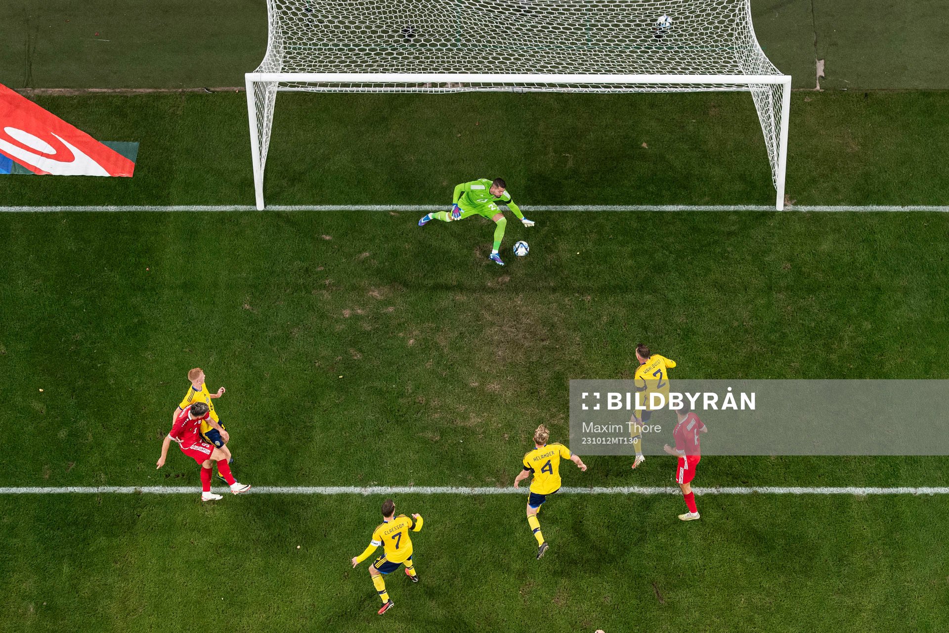 Ion Nicolaescu of Moldova scores the 2-1 goal behind goalkeeper Kristoffer Nordfeldt of Sweden during the international friendly football match between Sweden and Moldova on October 12, 2023 in Stockholm.