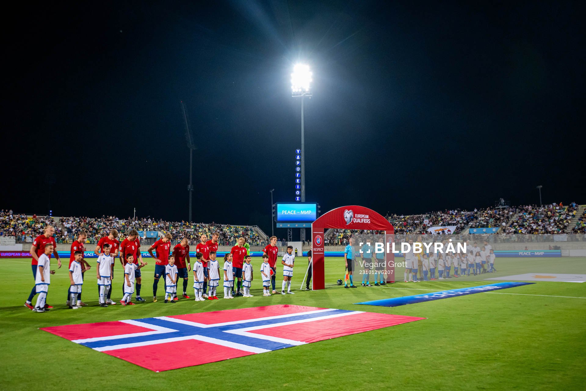 Players of Norway and Cyprus line up