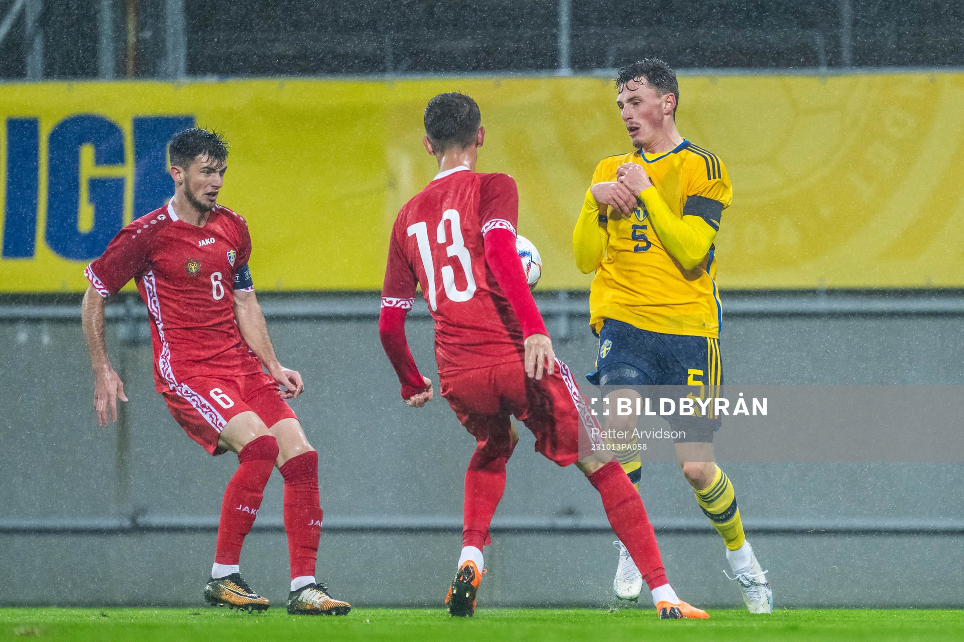 Vicu Bulmaga and Andrei Motoc of Moldova defend against Noah Persson of Sweden during the UEFA European Under-21 Qualifier football match between Sweden and Moldova on October 13, 2023 in Falkenberg.