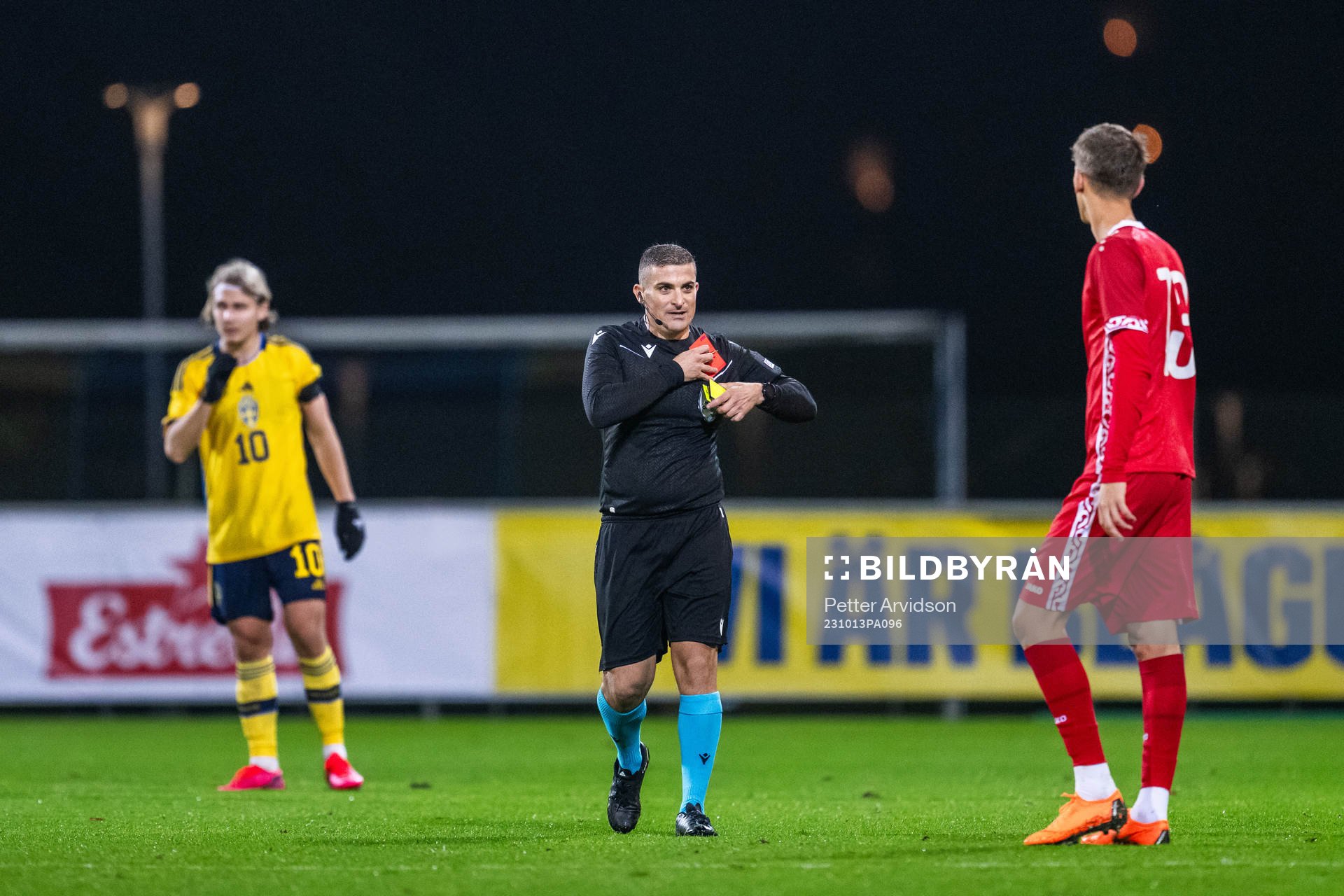 Referee Trustin Farrugia Cann picks up cards from his pocket