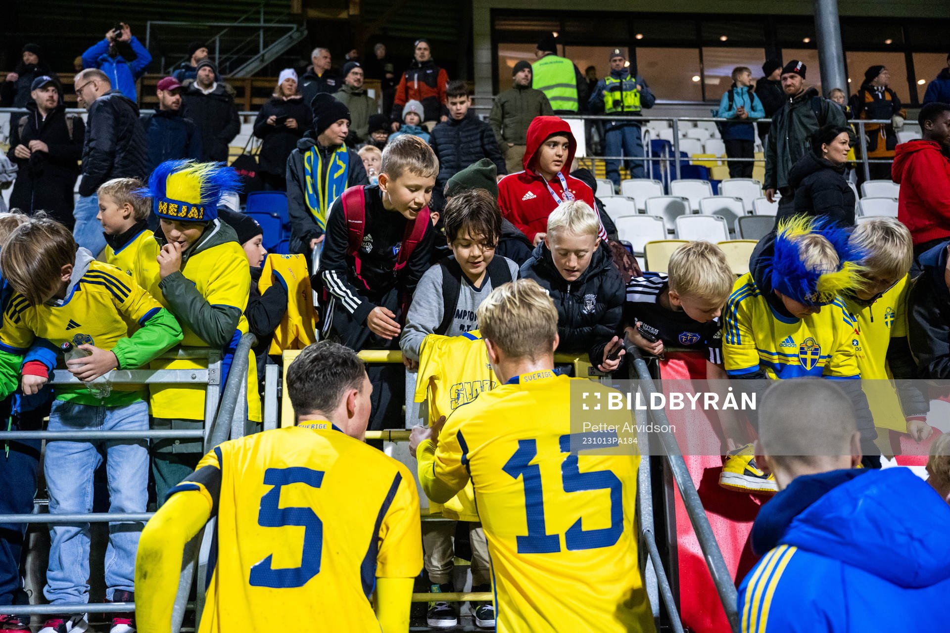 Noah Persson and Daniel Svensson of Sweden writes autographs