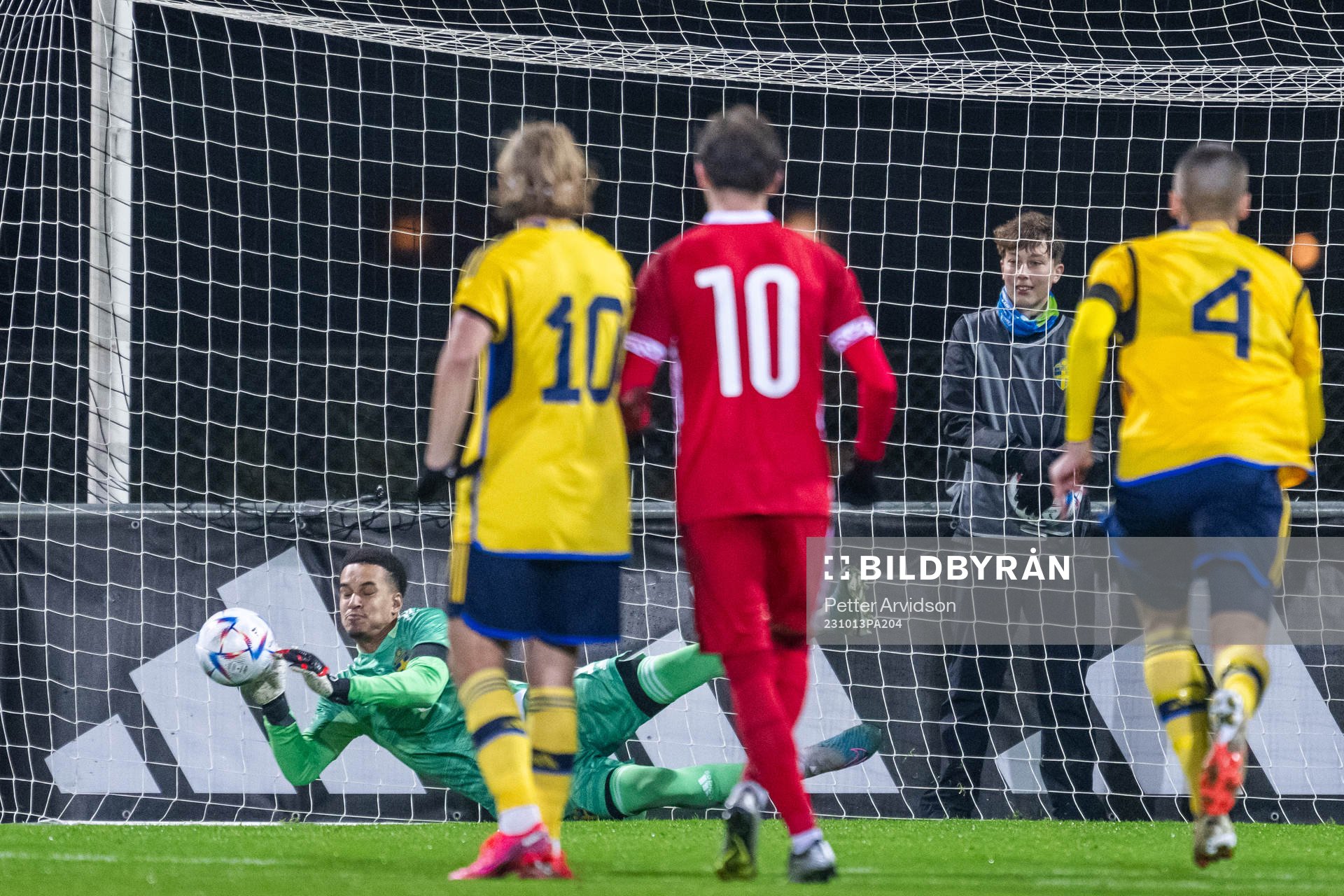 Goalkeeper Oliver Dovin of Sweden saves a penalty from Ion