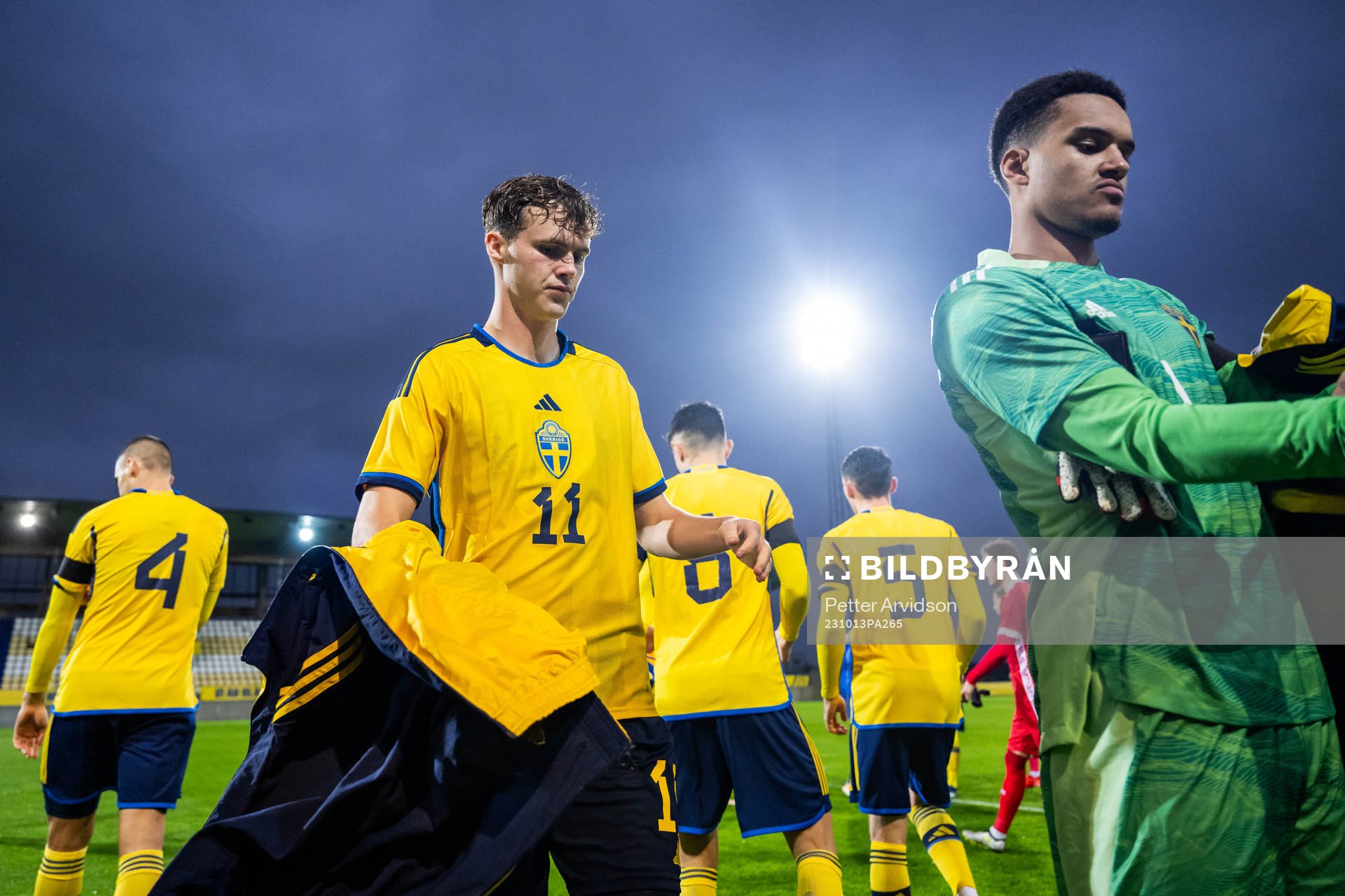 Williot Swedberg and goalkeeper Oliver Dovin of Sweden