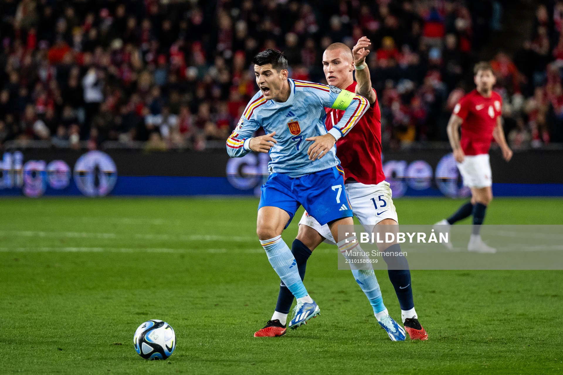 Álvaro Morata of Spain and Leo Østigård of Norway