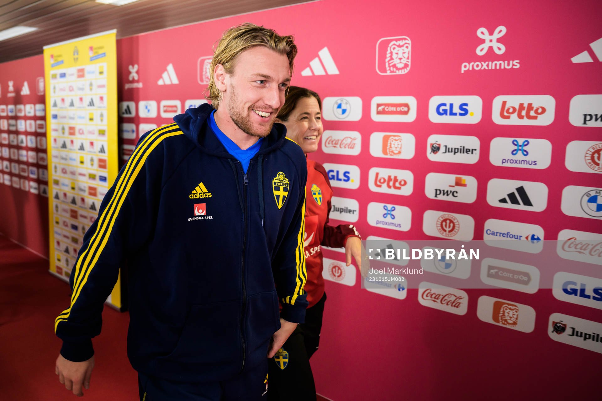 Emil Forsberg and media officer Petra Thorén of the Swedish national football team during a mixed zone session on October 15, 2023 in Brussels.