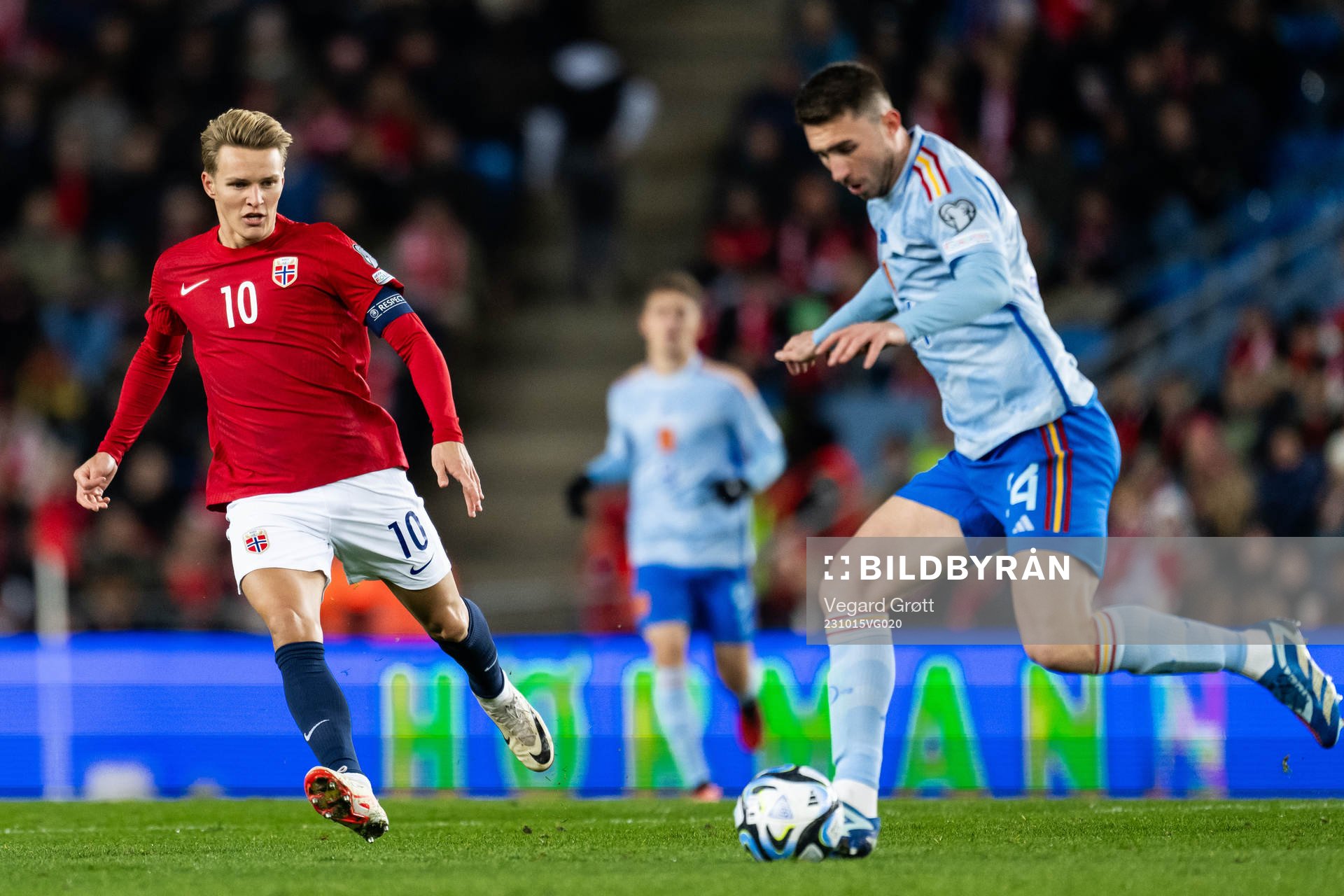 Martin Ødegaard of Norway and Aymeric Laporte of Spain