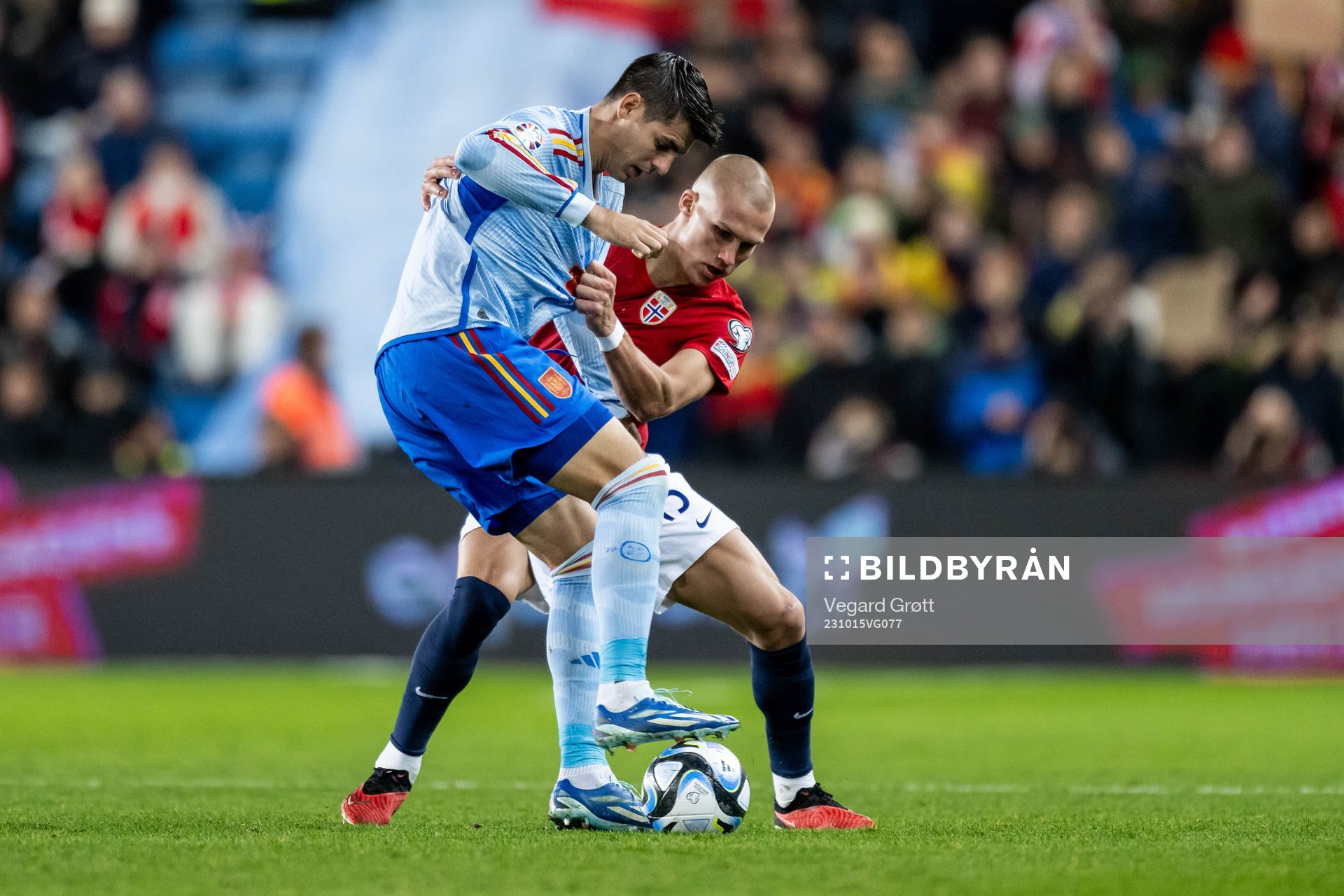 Álvaro Morata of Spain and Leo Østigård of Norway