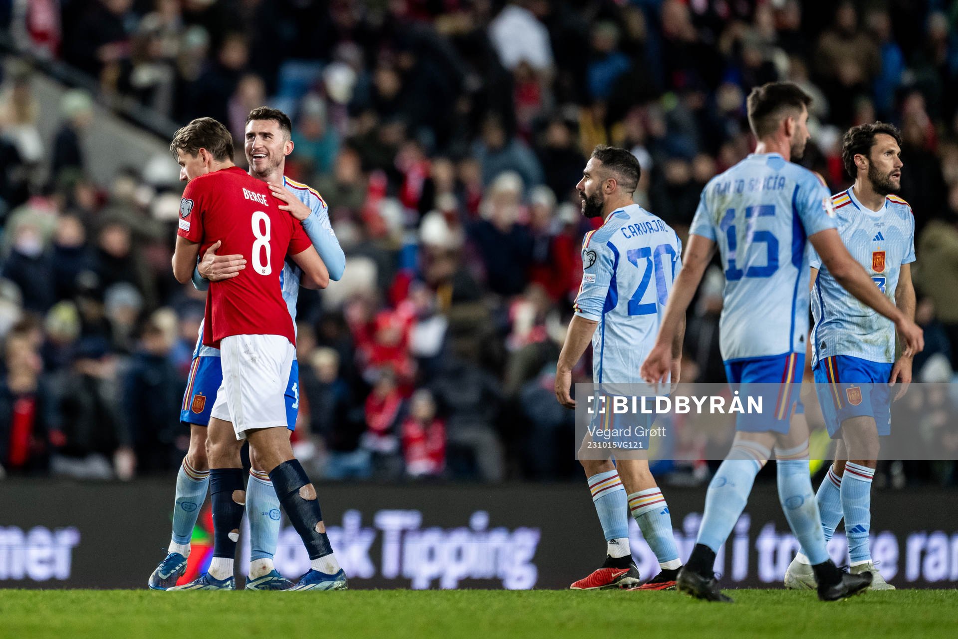 Sander Berge of Norway and Aymeric Laporte of Spain