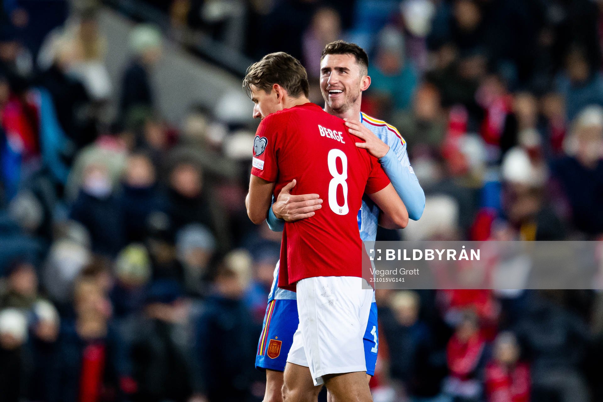 Sander Berge of Norway and Aymeric Laporte of Spain