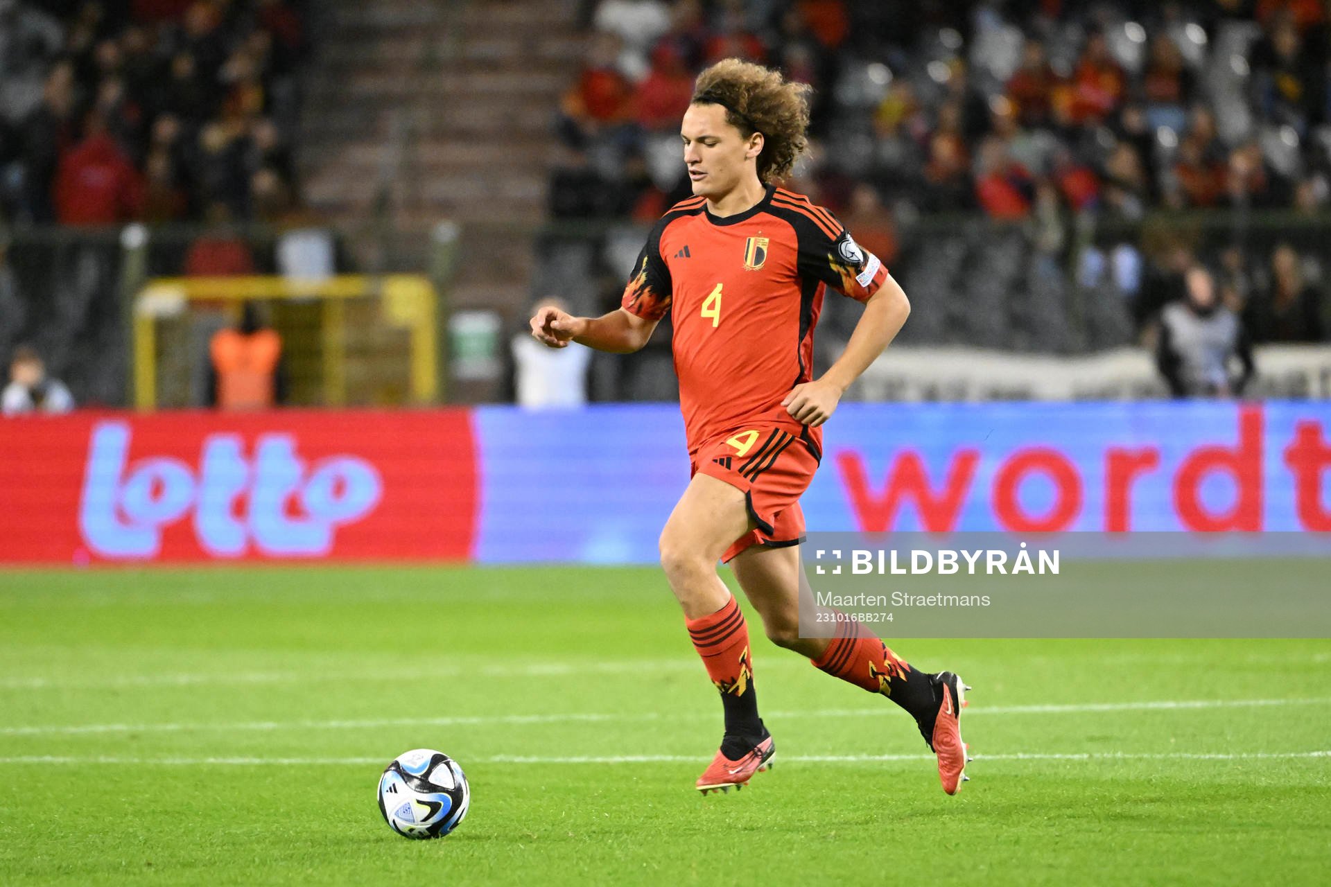 Wout Faes of Belgium in action with the ball