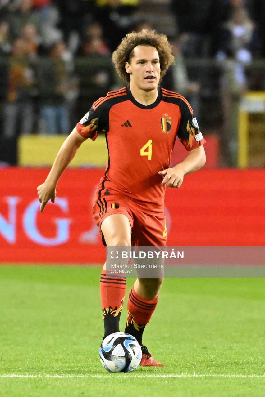 Wout Faes of Belgium in action with the ball
