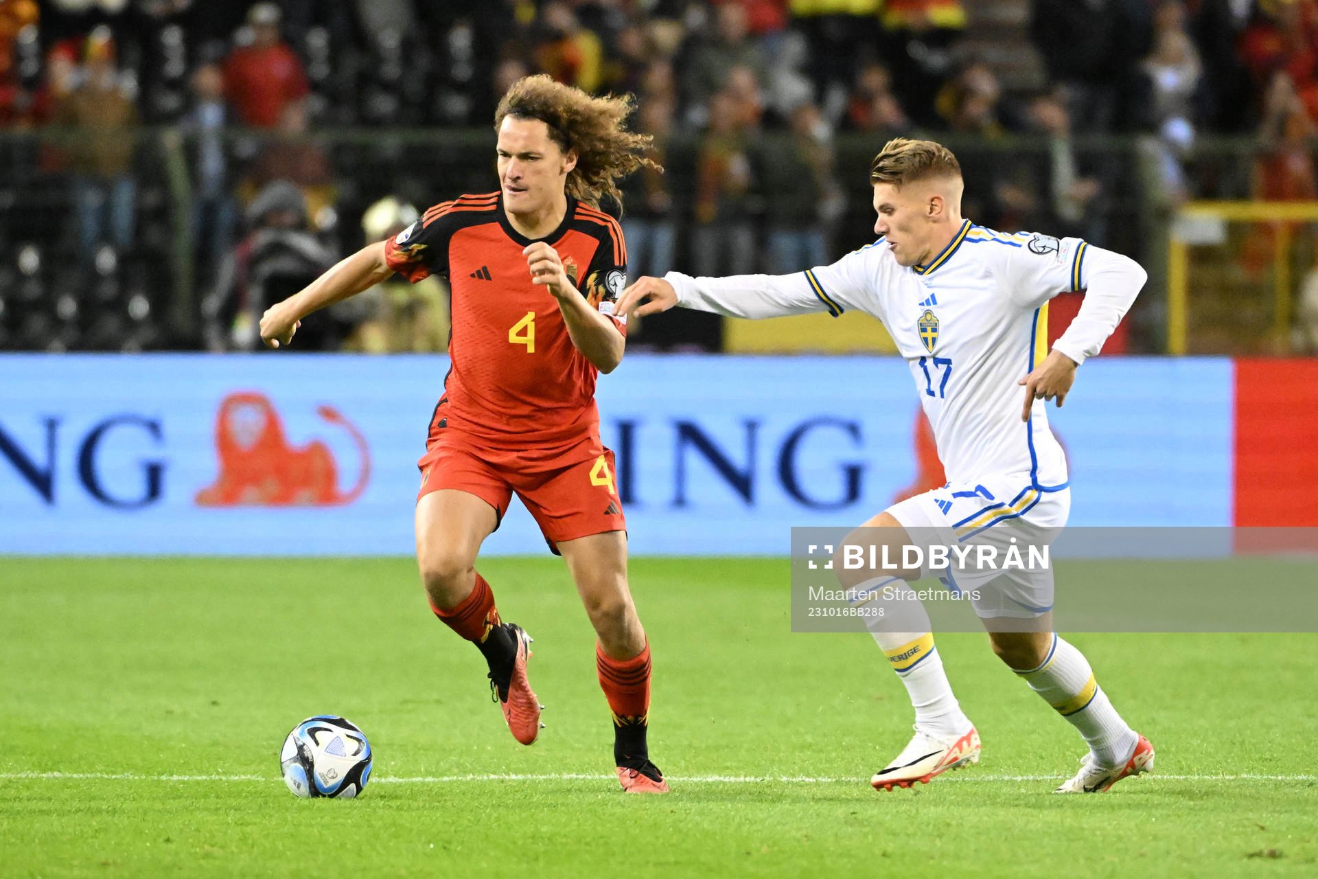 Wout Faes of Belgium battles for the ball with Viktor