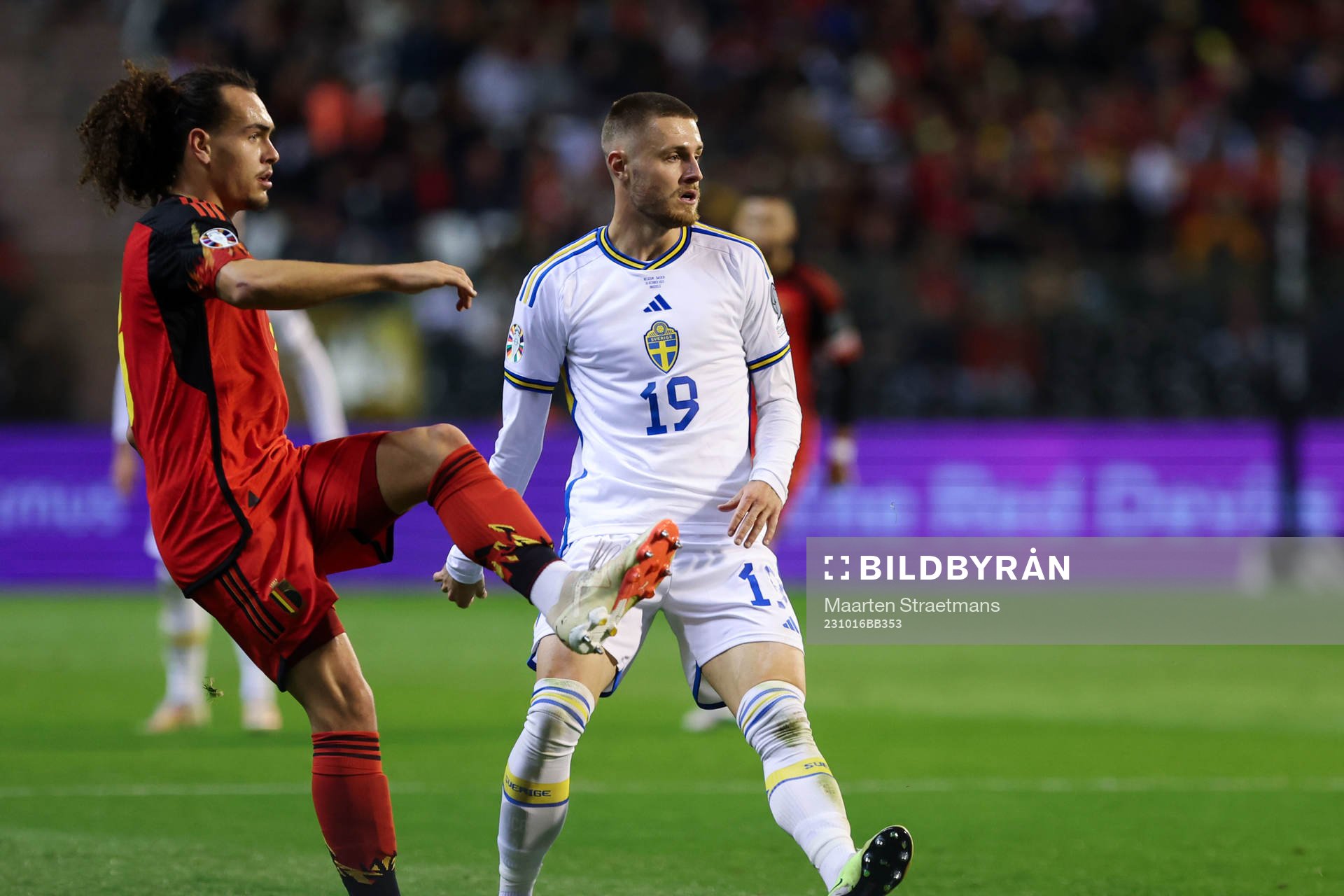 Arthur Theate of Belgium battles for the ball with Mattias