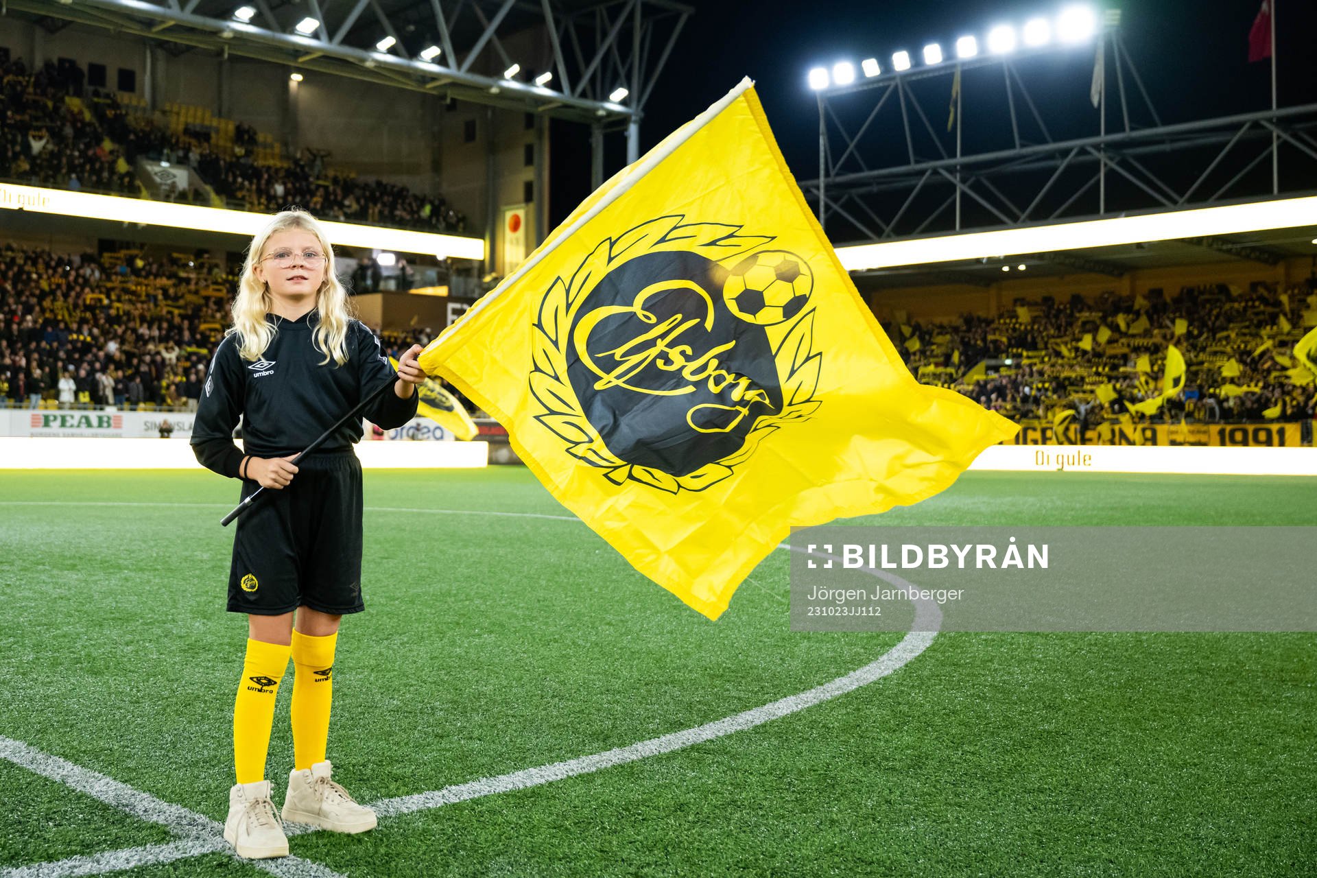Flagg bärare på planen