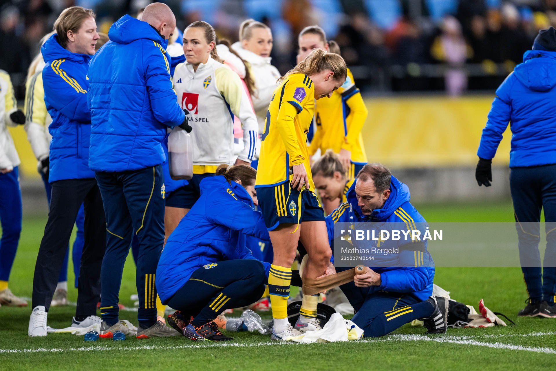 Anna Anvegård of Sweden gets medical attention to her calf