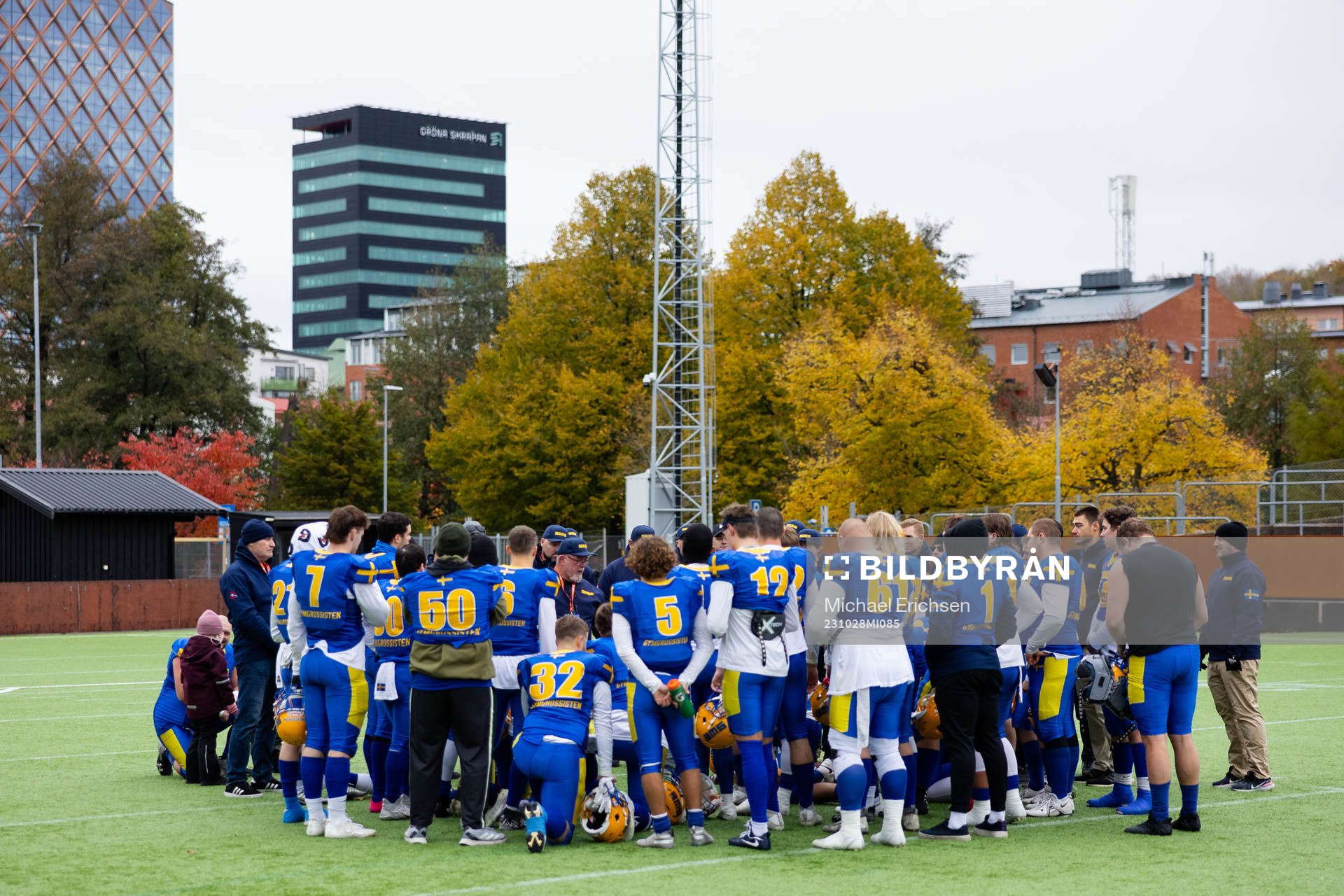 Players and staff gathered