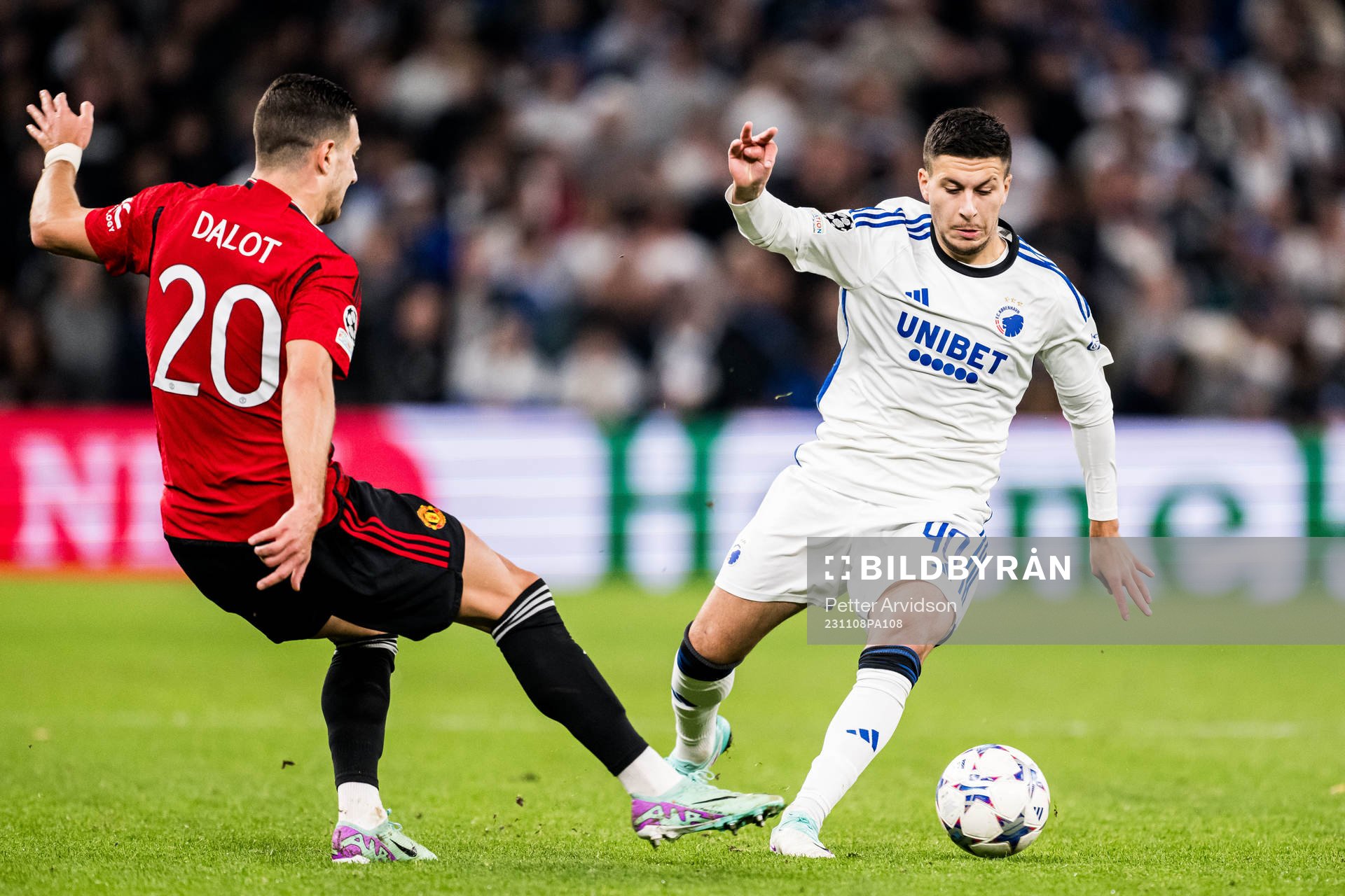 Diogo Dalot of Manchester United and Roony Bardghji of FC