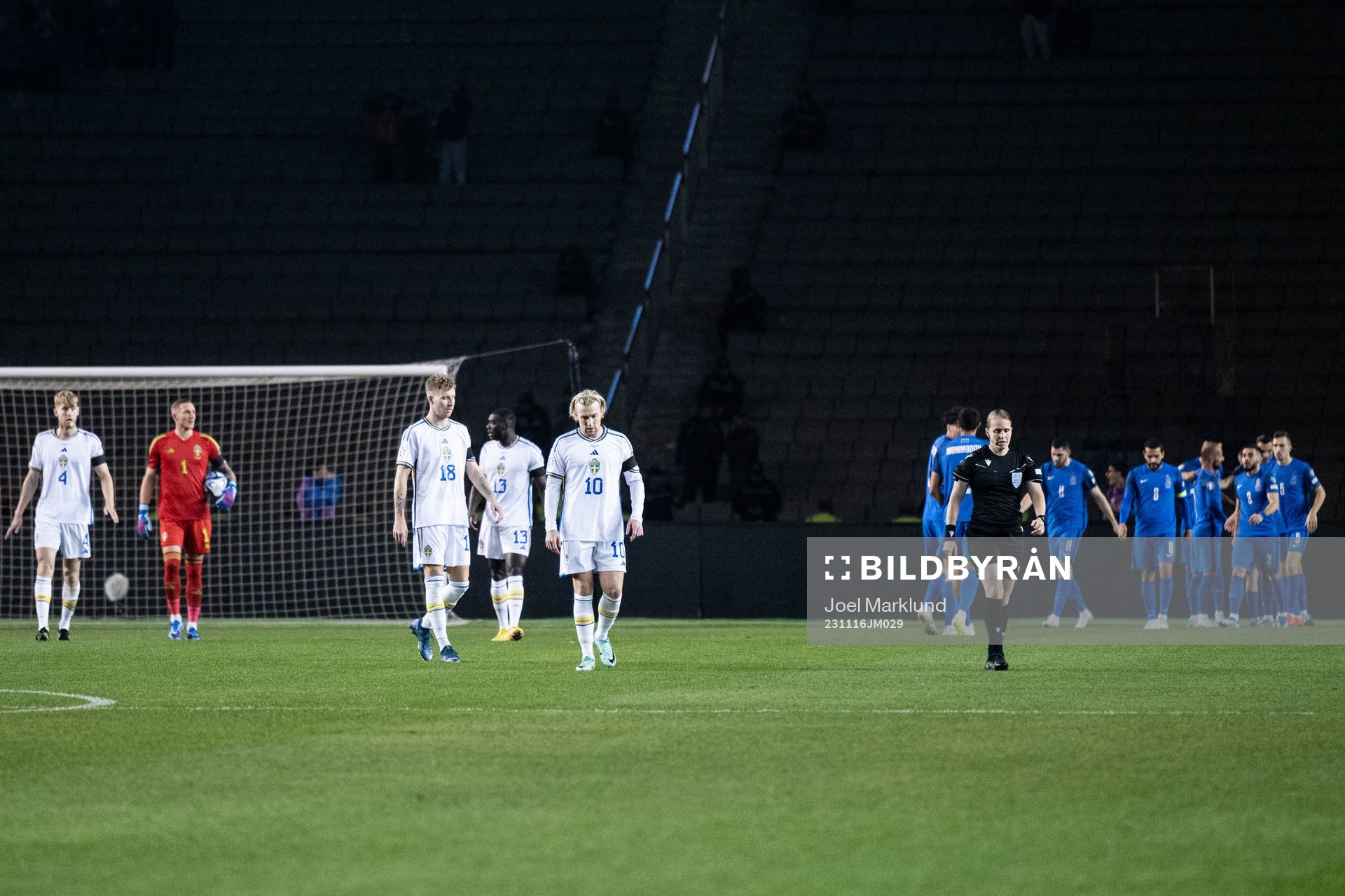 Samuel Gustafson and Emil Forsberg of Sweden look dejected