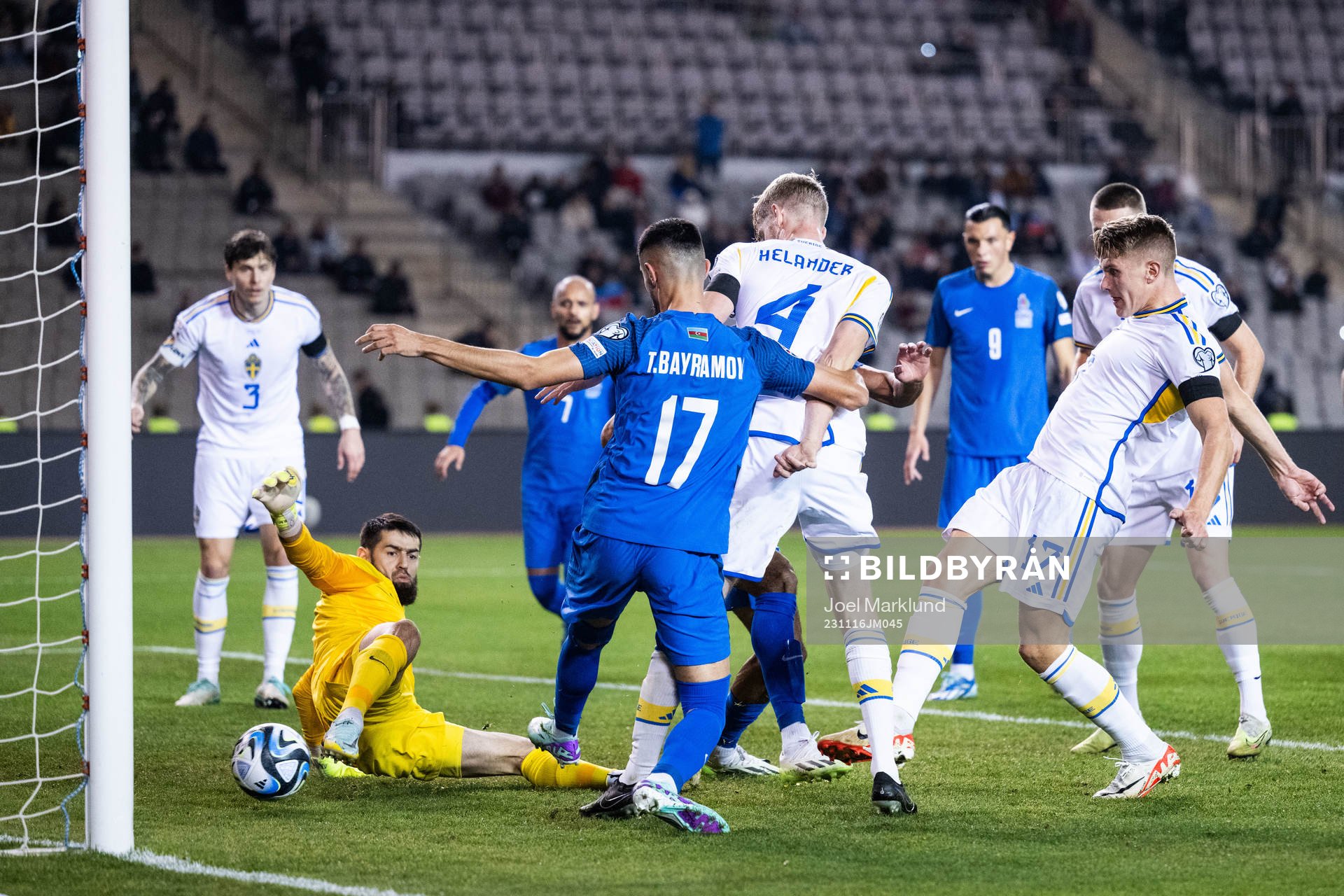 goalkeeper Shakhrudin Magmomedaliyev and Tural Bayramov of