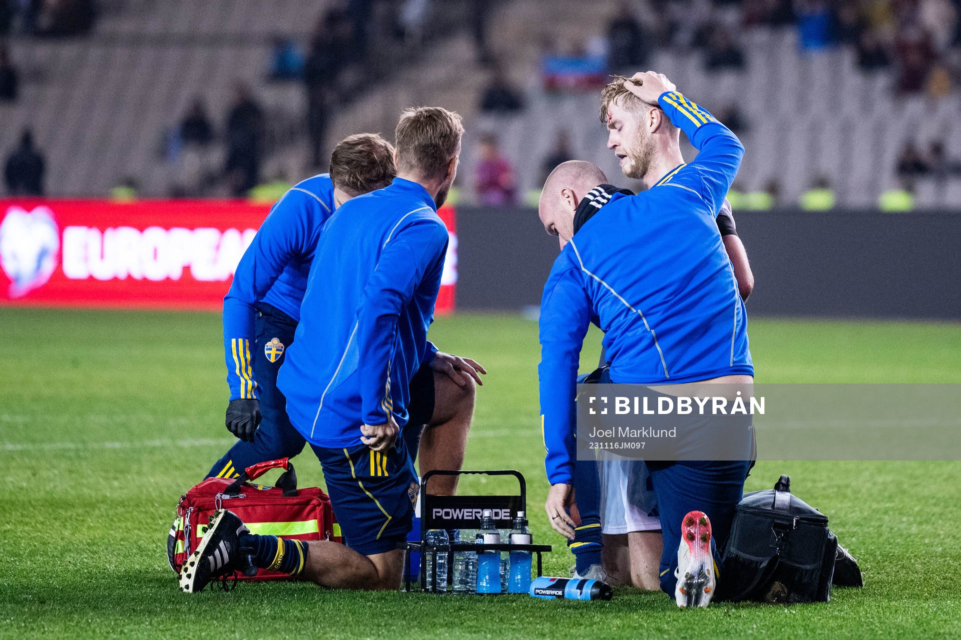 Filip Helander of Sweden receives medical attention