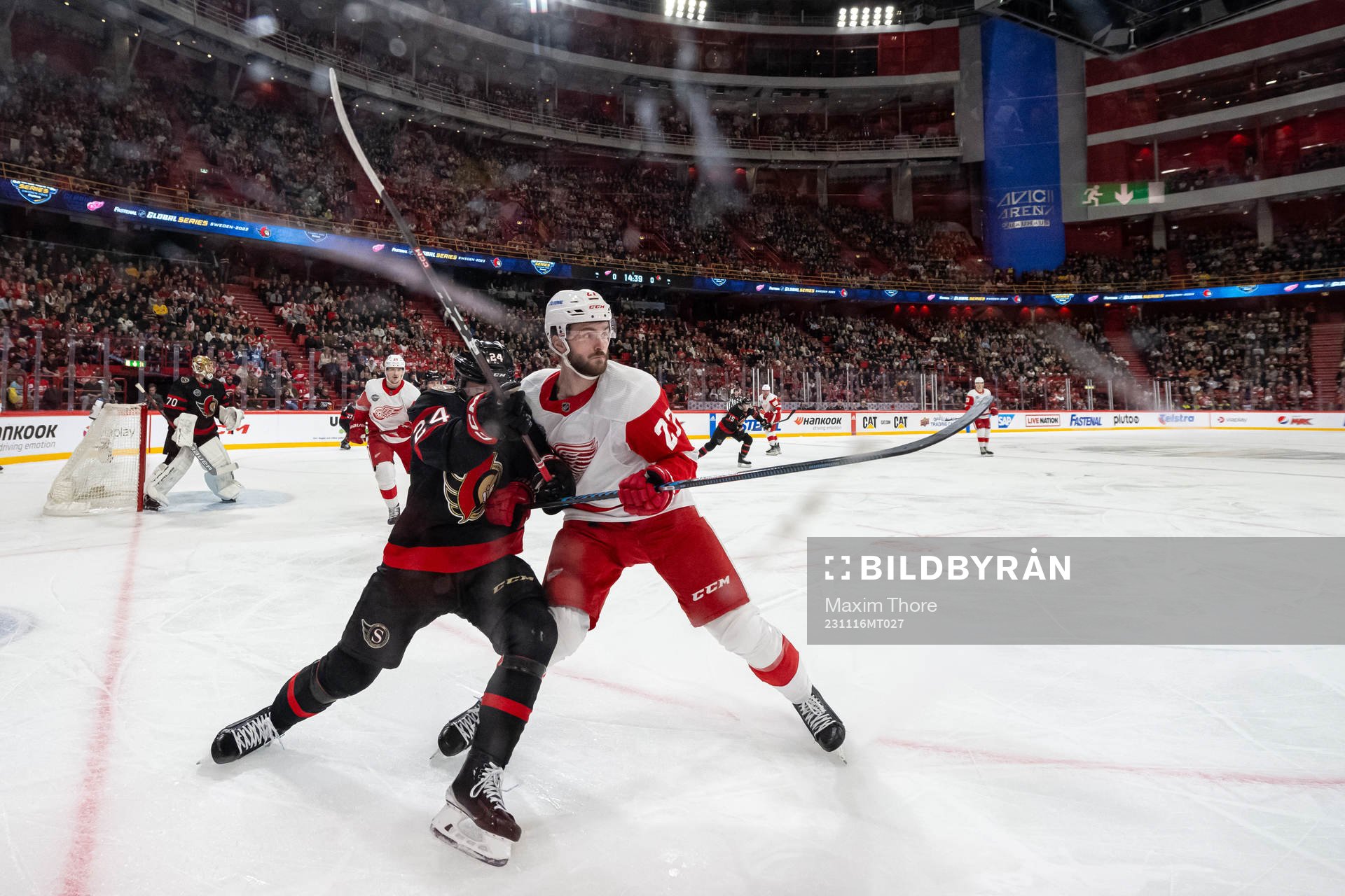 Klim Kostin of Detroit Red Wings and Travis Hamonic of