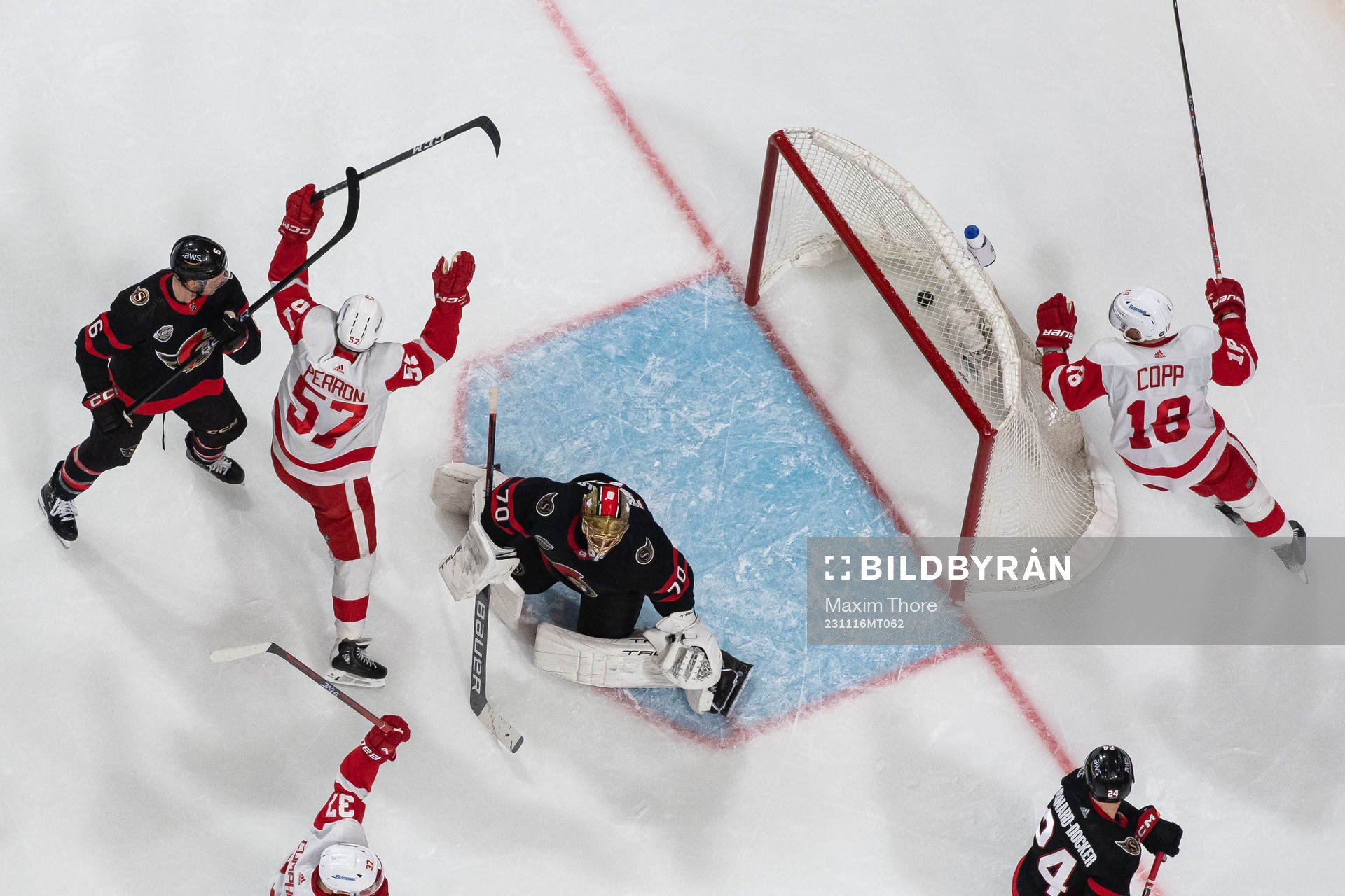 Andrew Copp and David Perron of Detroit Red Wings celebrate