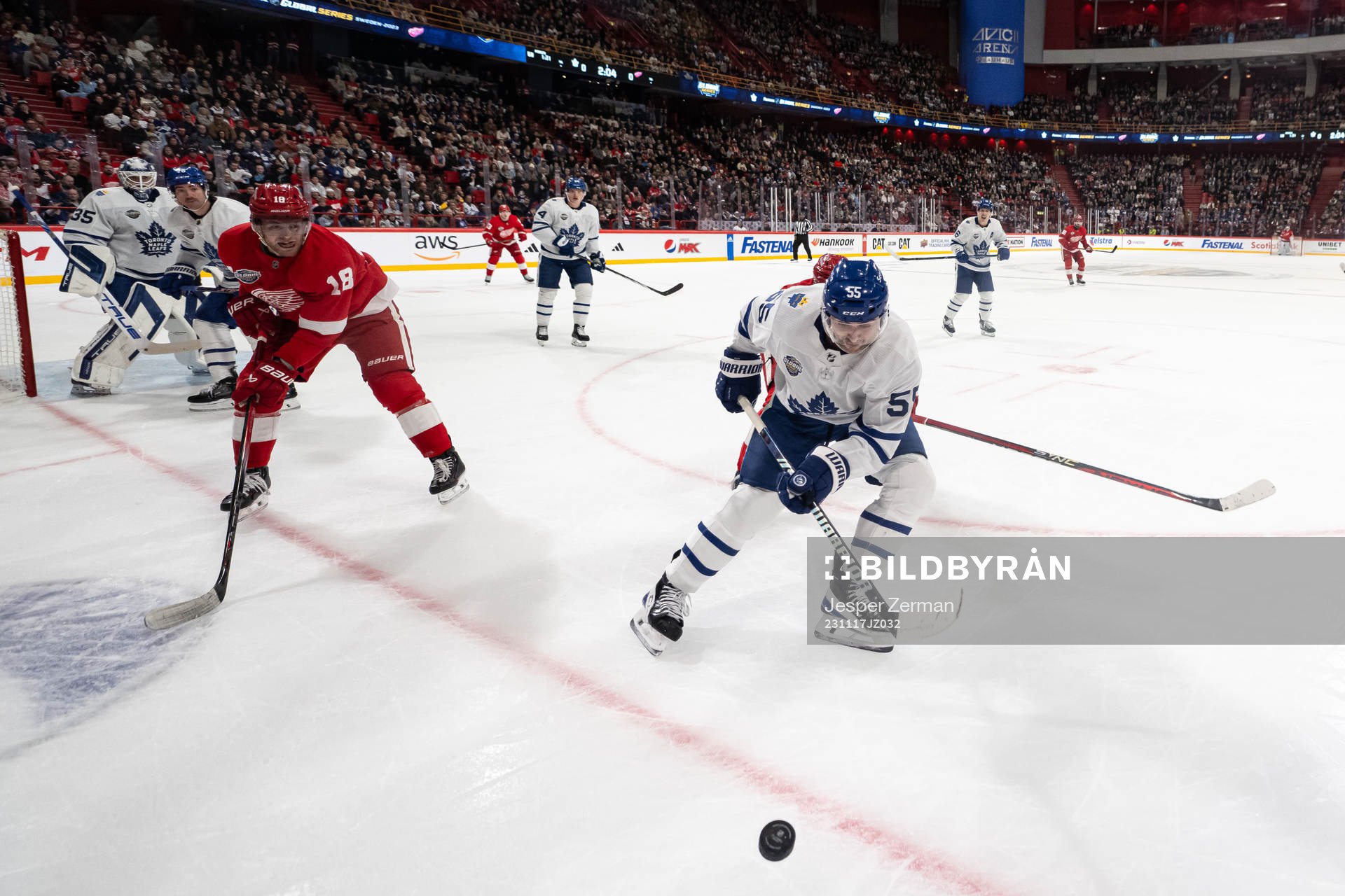 Andrew Copp of Detroit Red Wings and Mark Giordano of