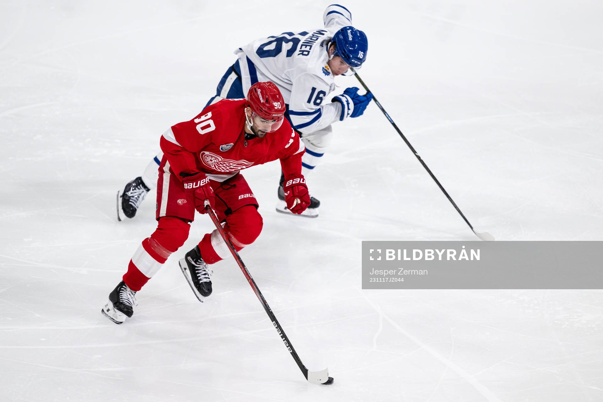 Joe Veleno of Detroit Red Wings and Mitchell Marner of