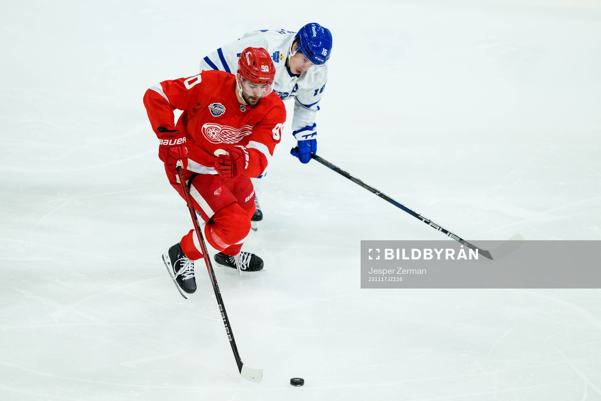 Joe Veleno of Detroit Red Wings and Mitchell Marner of