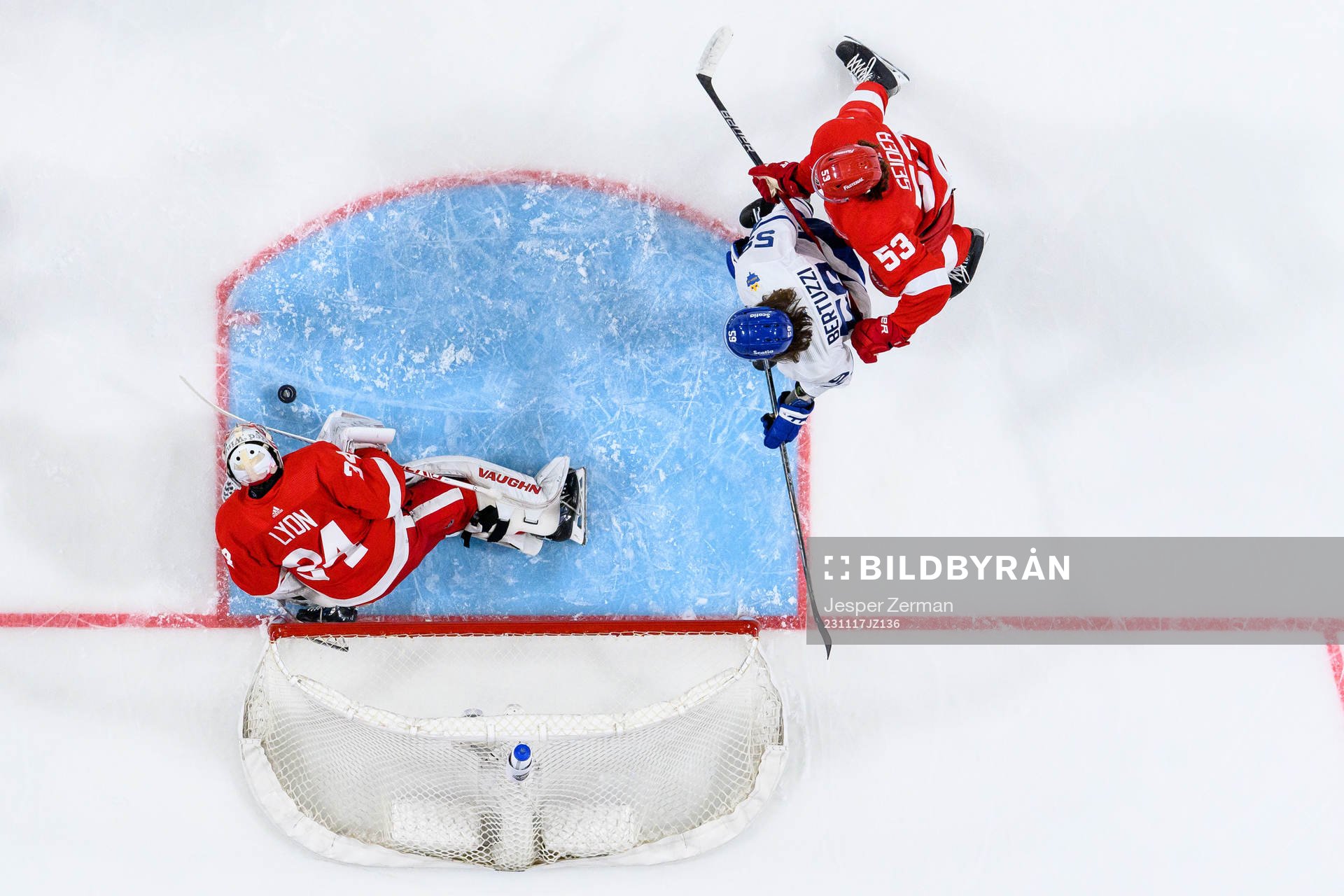 goalkeeper Alex Lyon and Moritz Seider of Detroit Red Wings