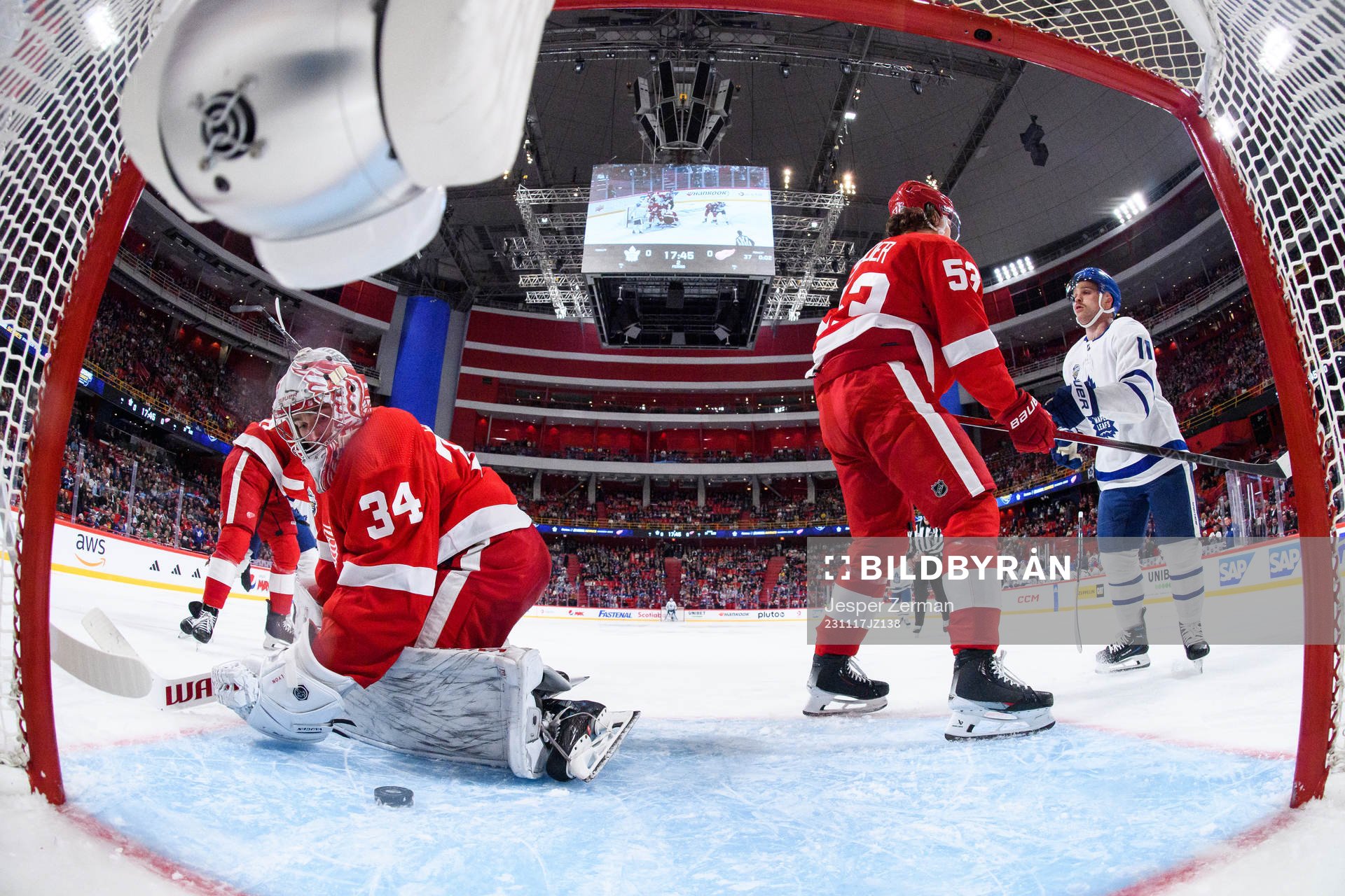 goalkeeper Alex Lyon and Moritz Seider of Detroit Red Wings