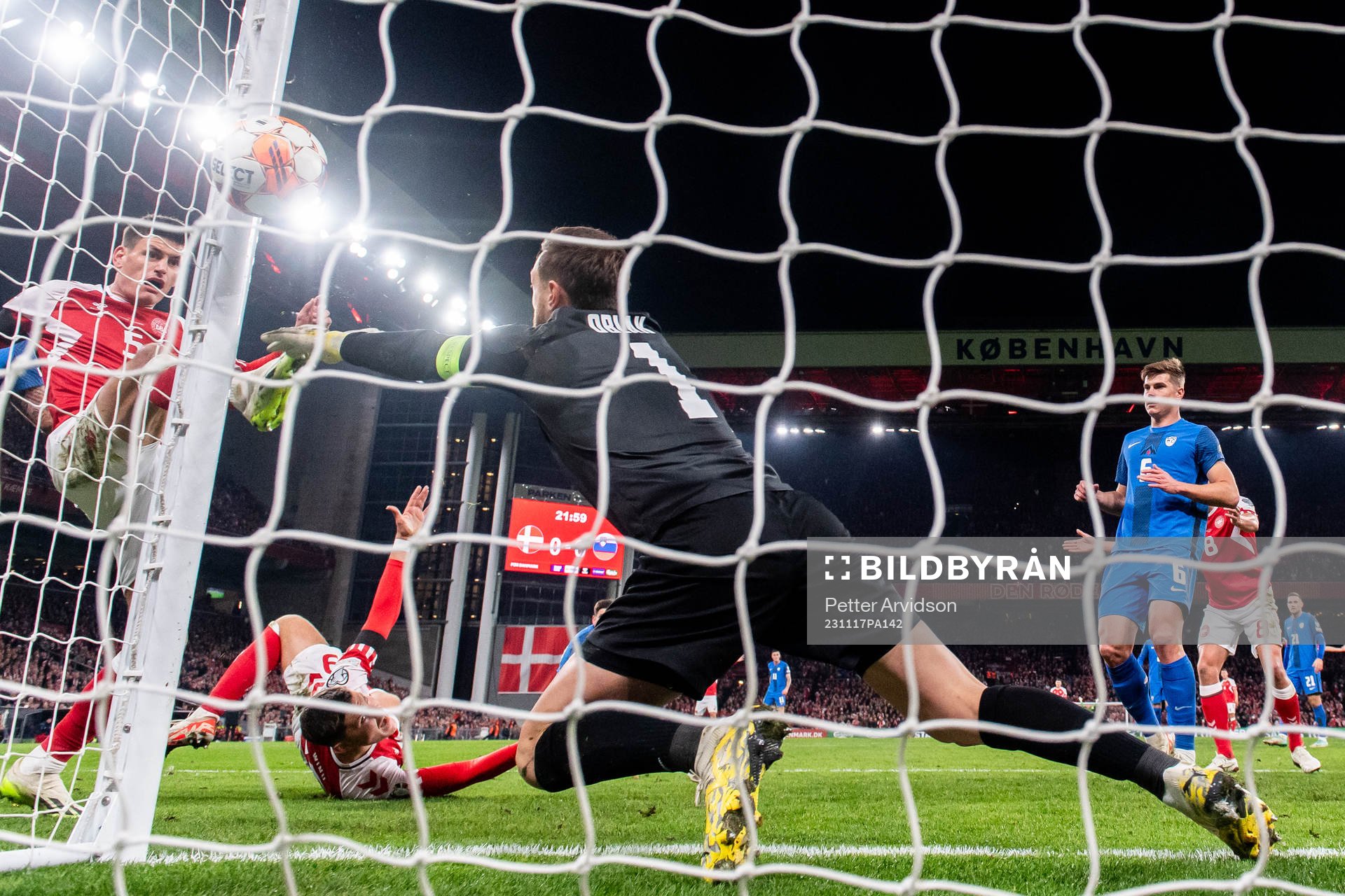 Joakim Mæhle of Denmark against goalkeeper Jan Oblak of