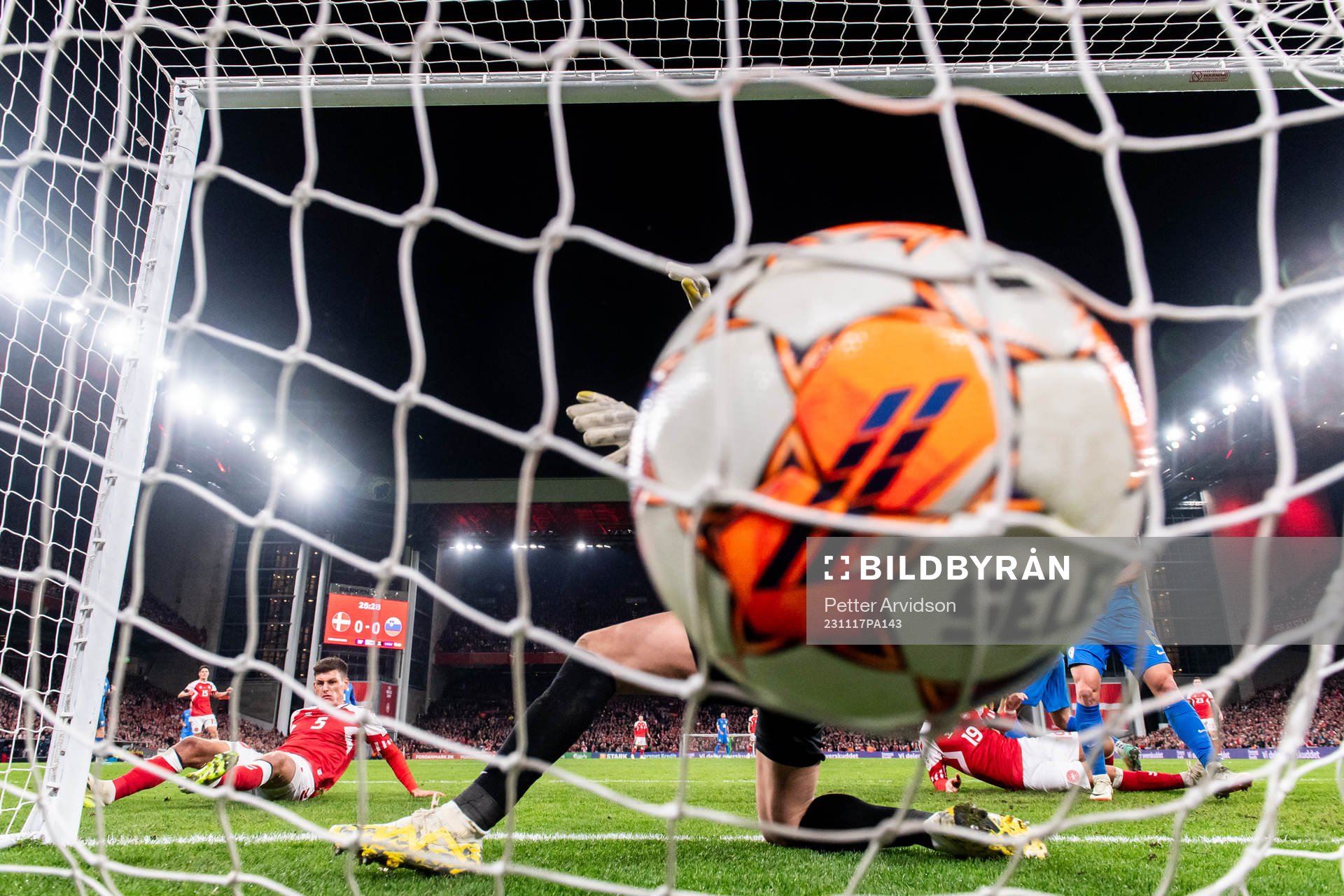 Joakim Mæhle of Denmark scores the 1-0 goal against goalkeeper Jan Oblak of Slovenia during the UEFA Euro Qualifier football match between Denmark and Slovenia on November 17, 2023 in Copenhagen. 