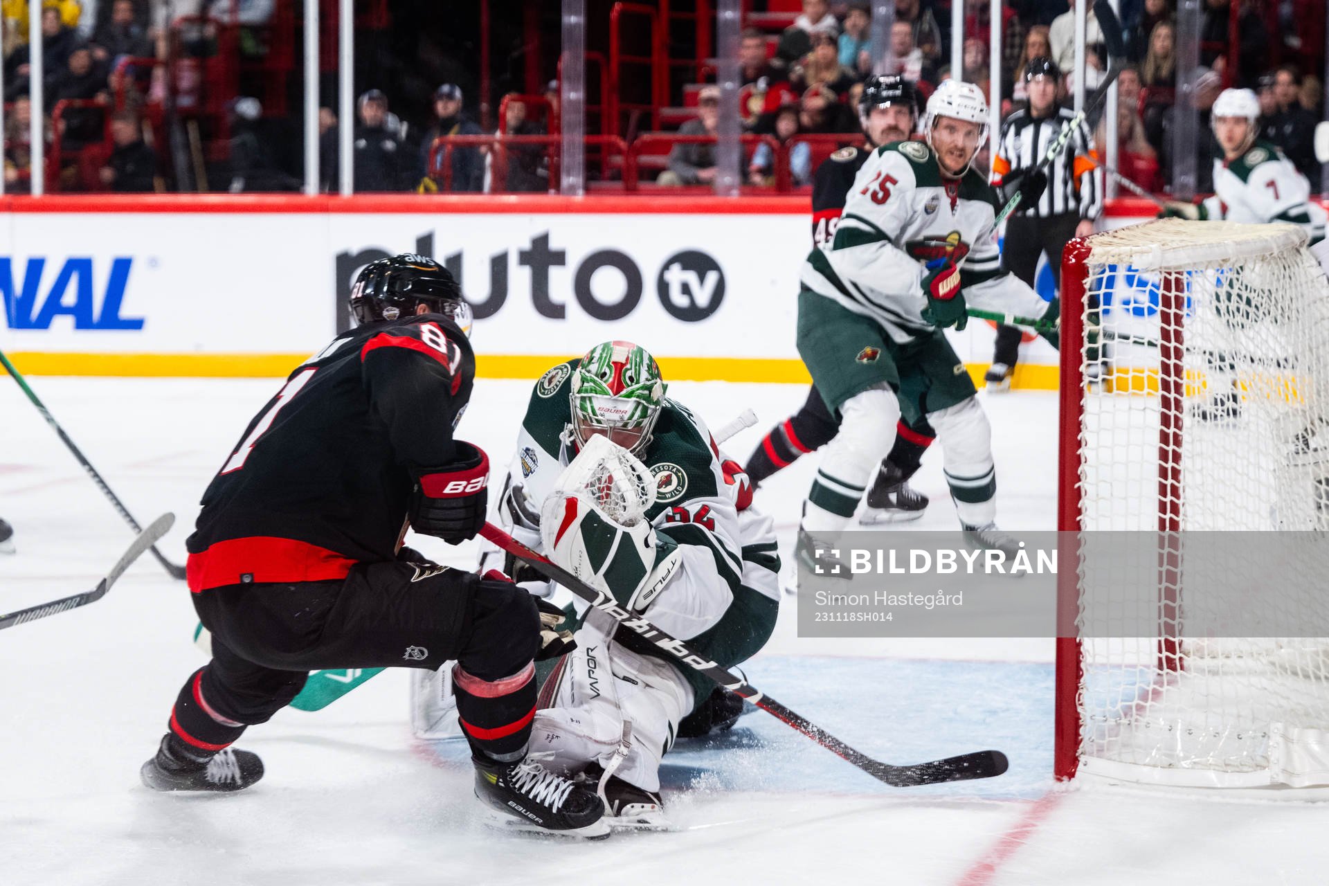 Dominik Kubalik of Ottawa Senators and goaltender Filip