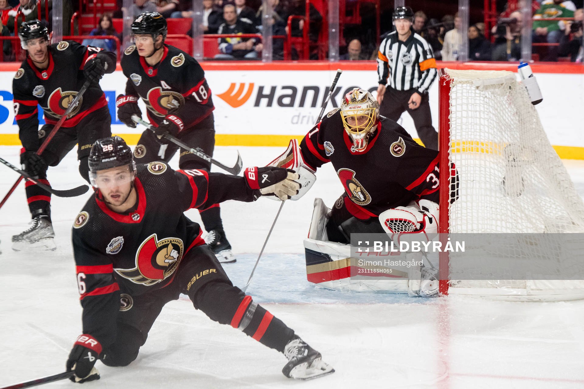 Erik Brännström and goaltender Anton Forsberg of Ottawa