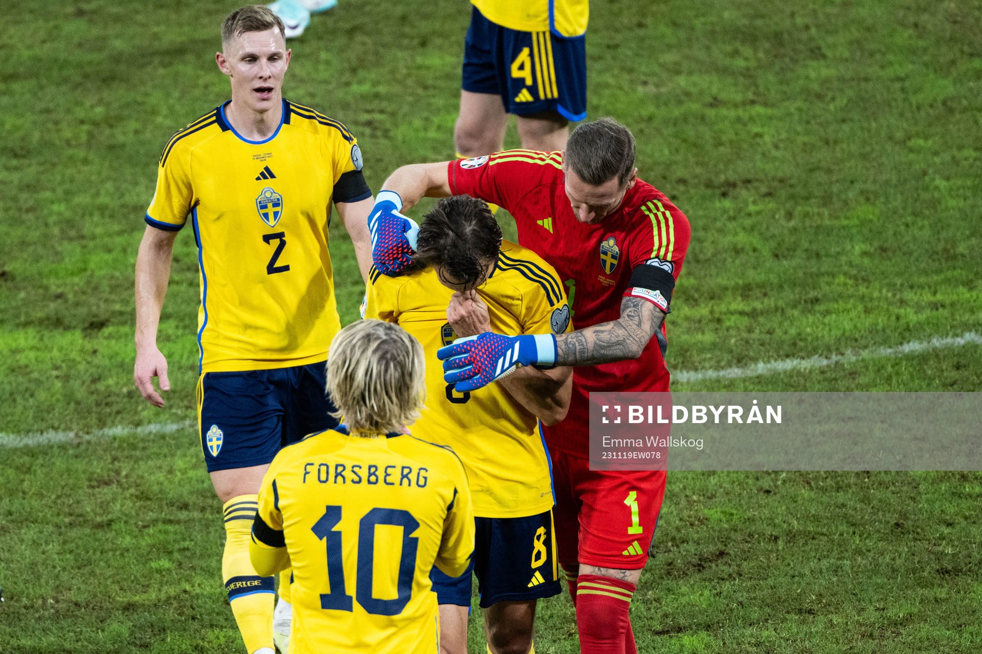 Albin Ekdal and goalkeeper Robin Olsen of Sweden
