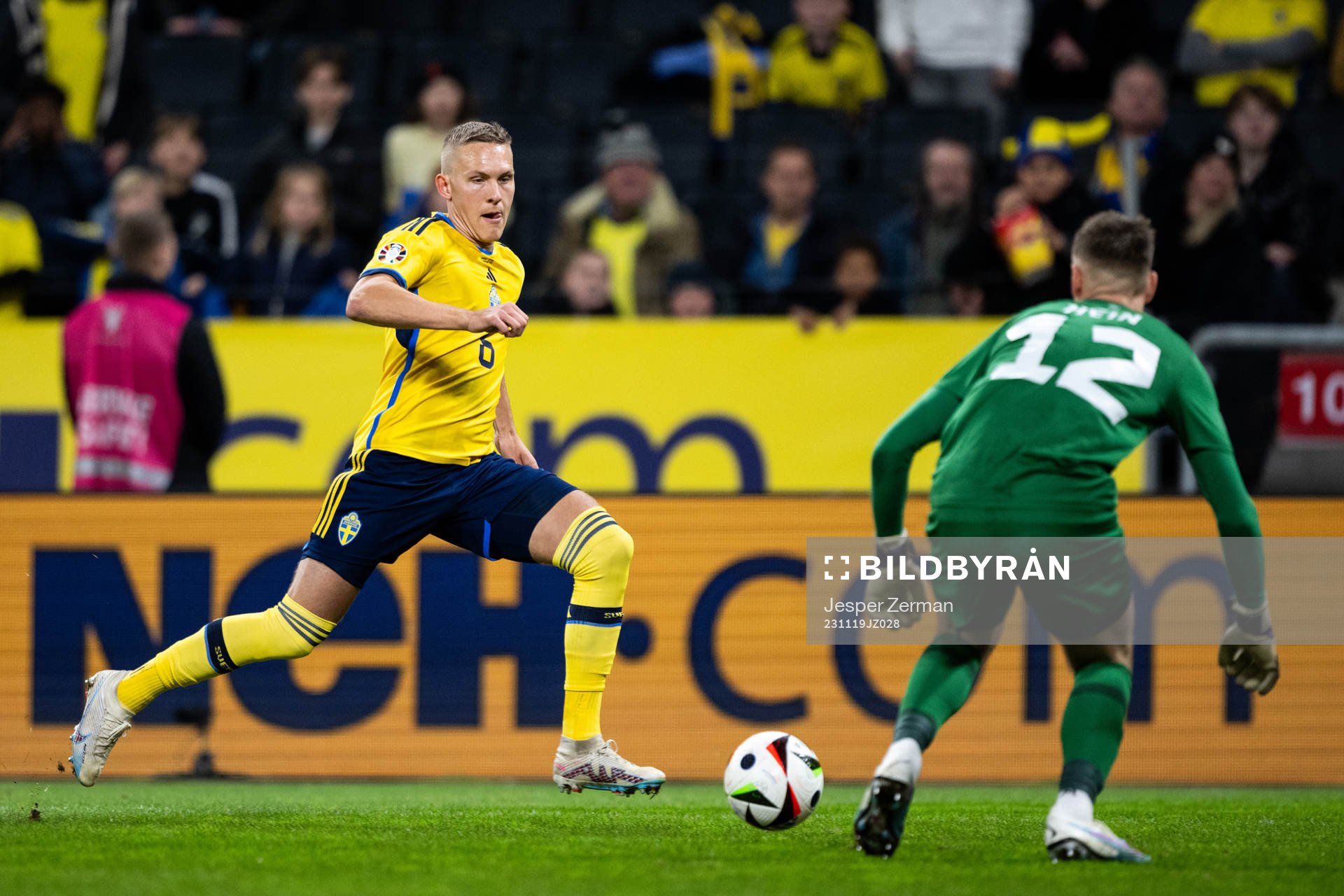 Ludwig Augustinsson of Sweden and goalkeeper Karl Jakob