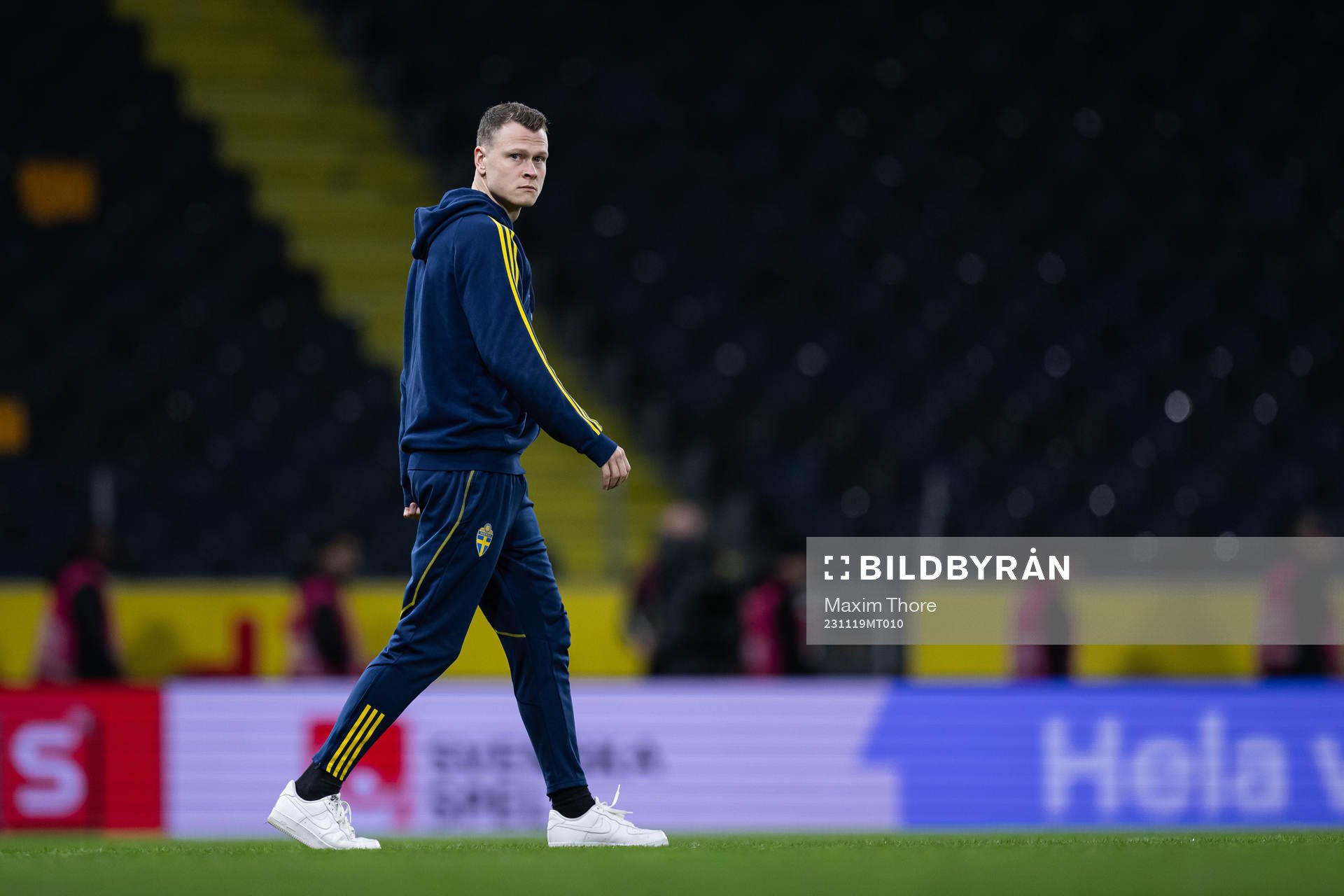 Viktor Claesson of Sweden inspect the pitch