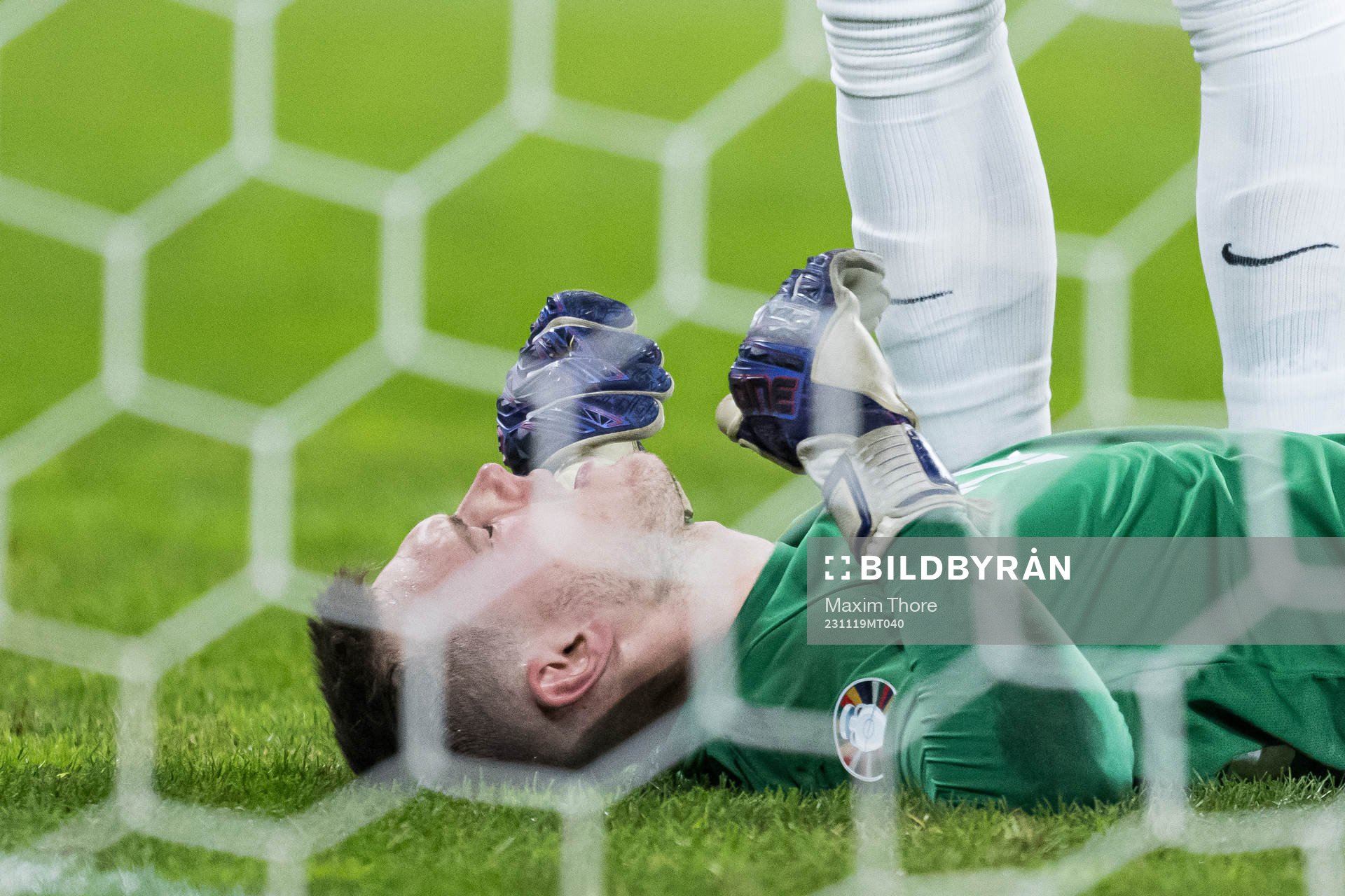 Goalkeeper Karl Jakob Hein of Estonia in pain