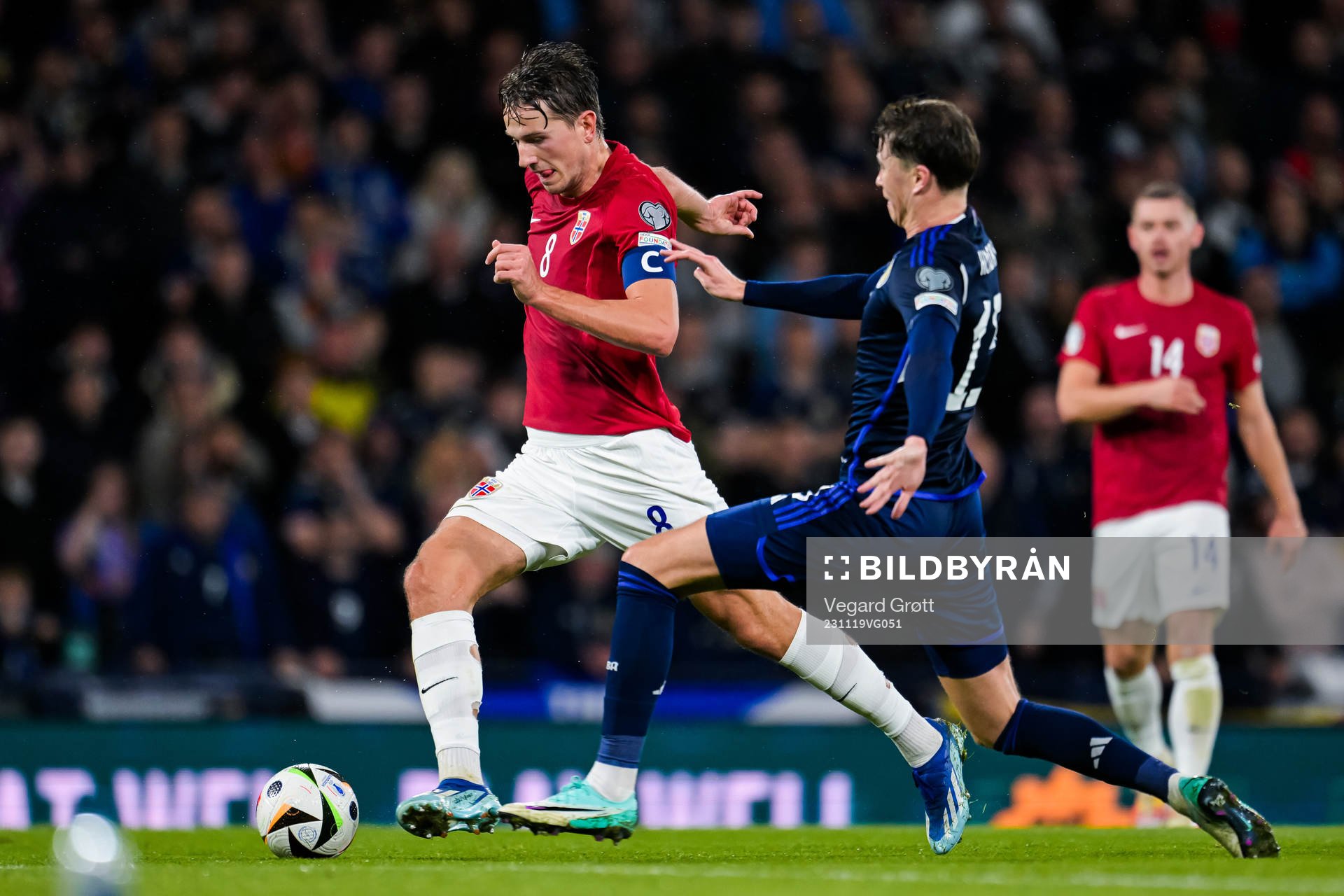Sander Berge of Norway and Jack Hendry of Scotland