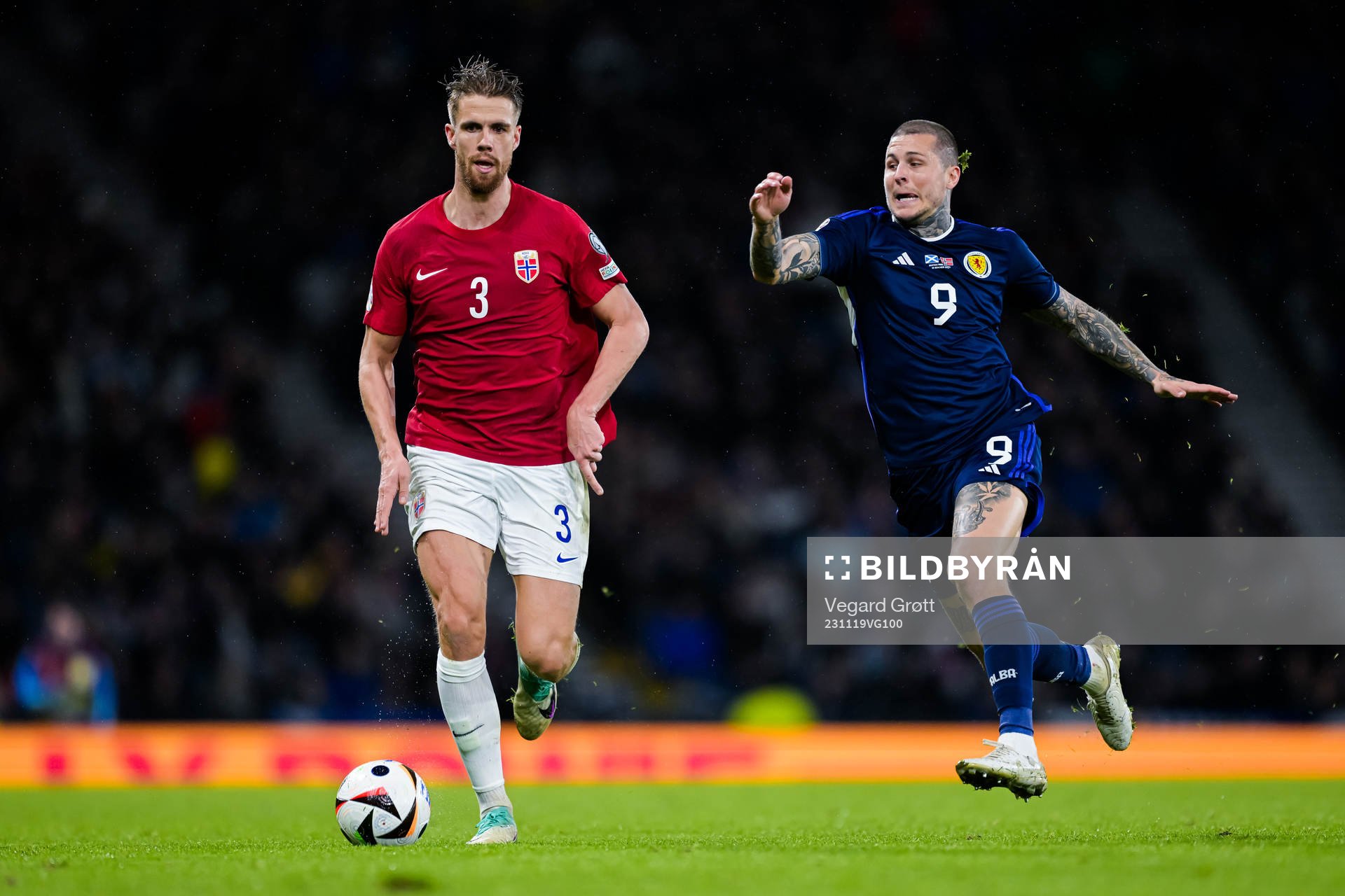 Kristoffer Ajer of Norway and Lyndon Dykes of Scotland