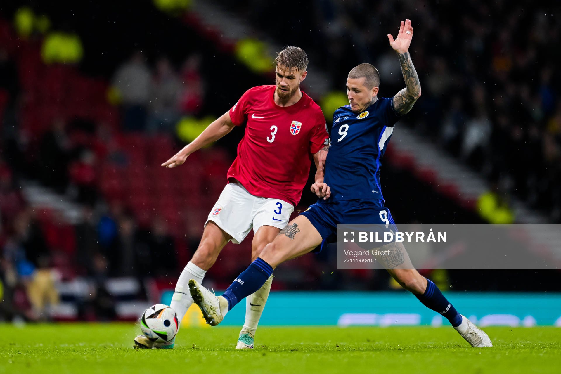Kristoffer Ajer of Norway and Lyndon Dykes of Scotland