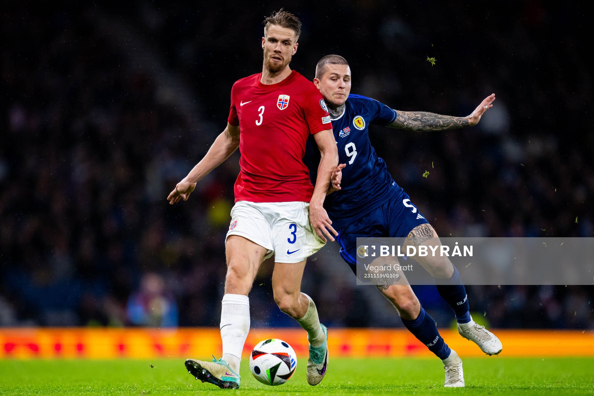 Kristoffer Ajer of Norway and Lyndon Dykes of Scotland