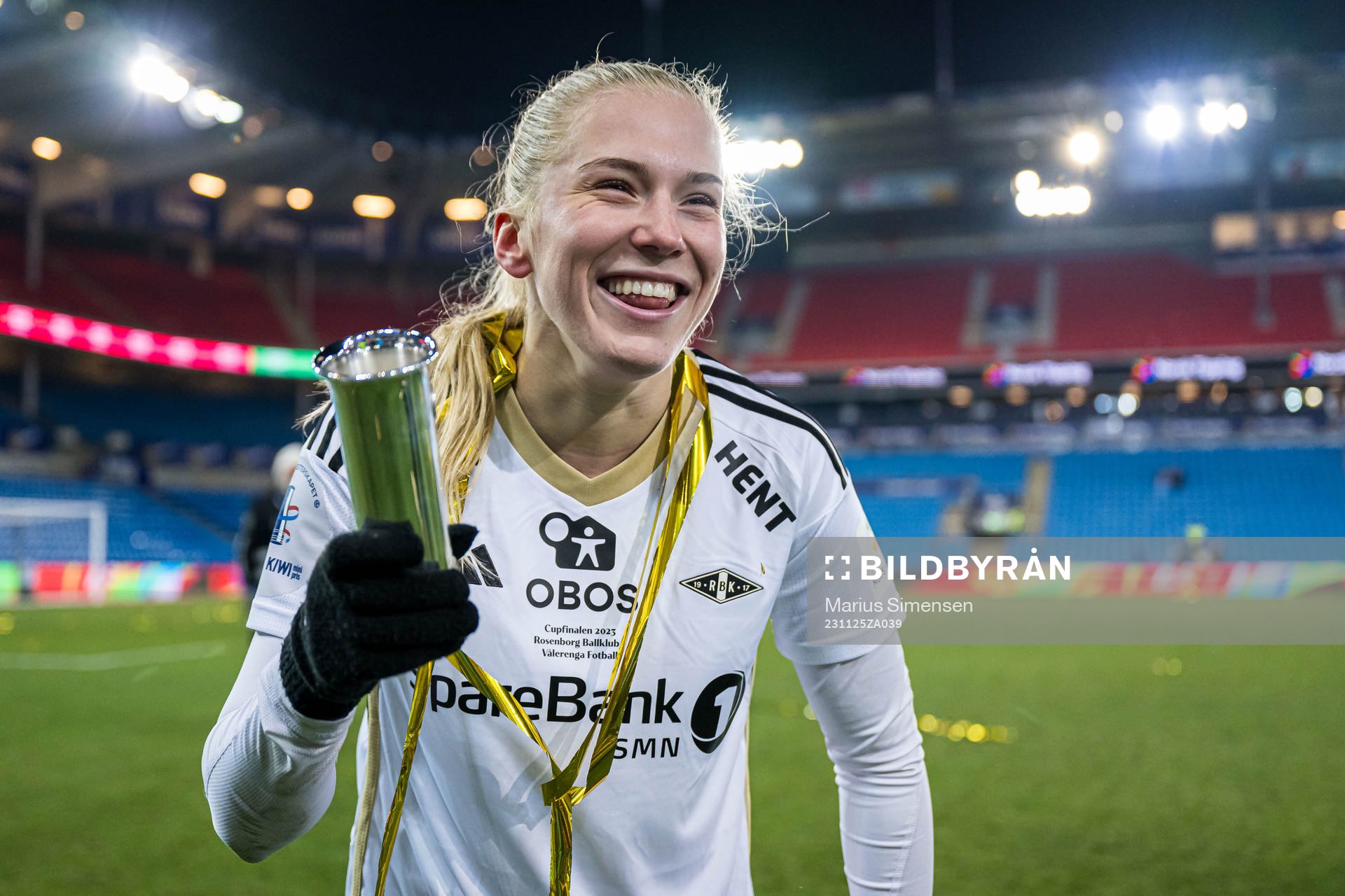 Emilie Nautnes of Rosenborg celebrates with the trophy