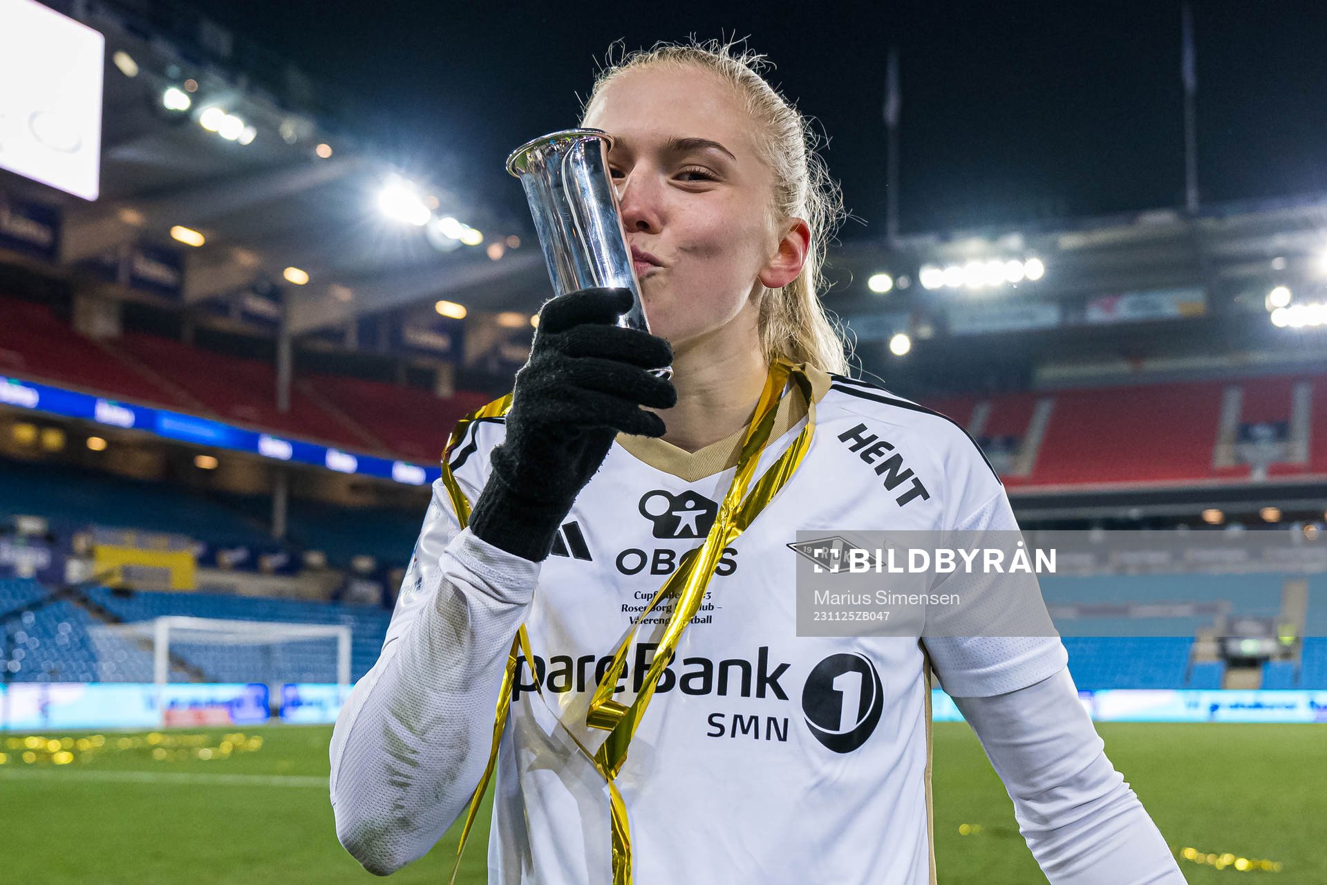Emilie Nautnes of Rosenborg celebrates with the trophy