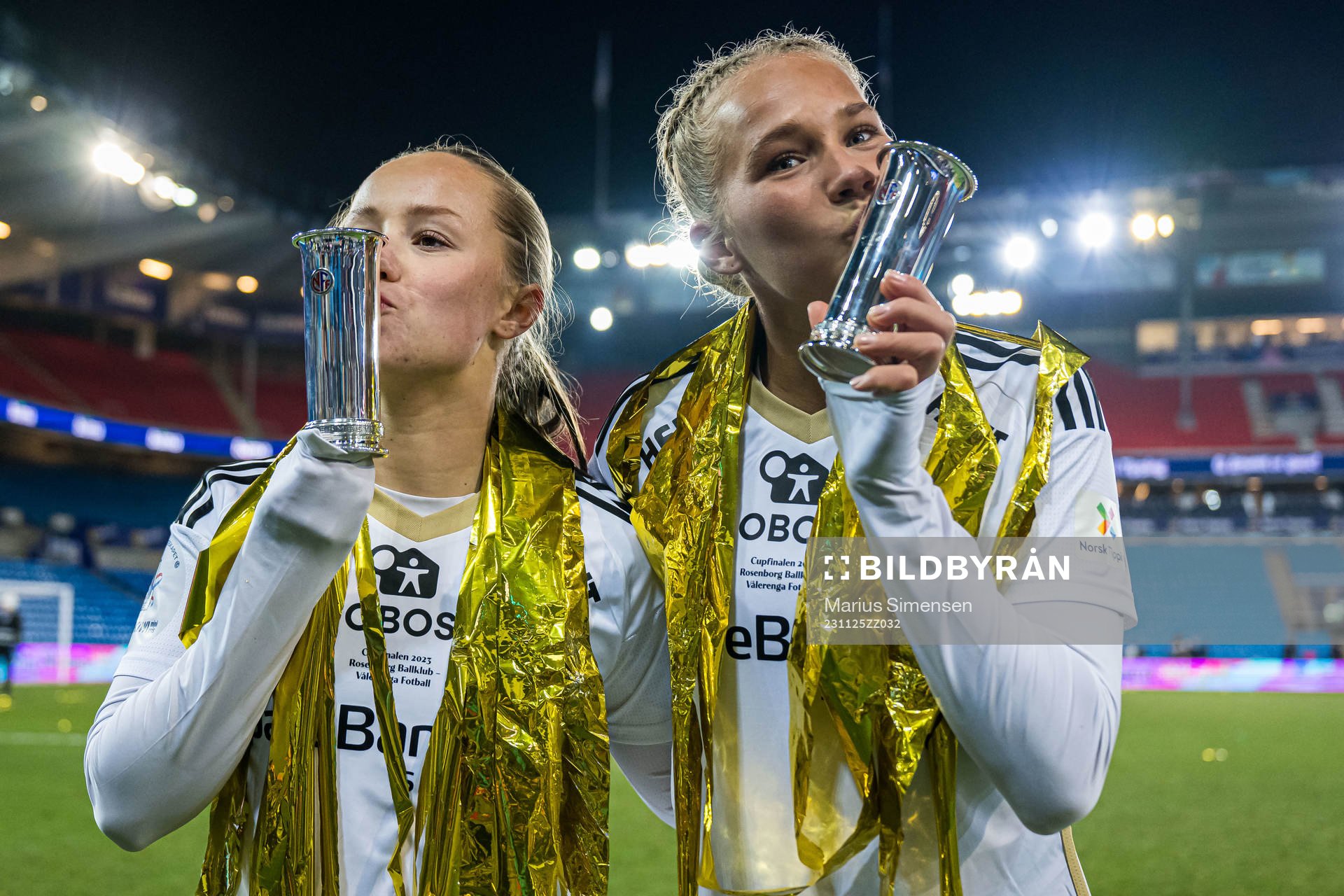 Vilde Hulaas Grøseth and Frøya Brennskag-Dorsin of Rosenborg celebrates with the trophy after the cup final between Rosenborg and Vålerenga on November 25, 2023 in Oslo.