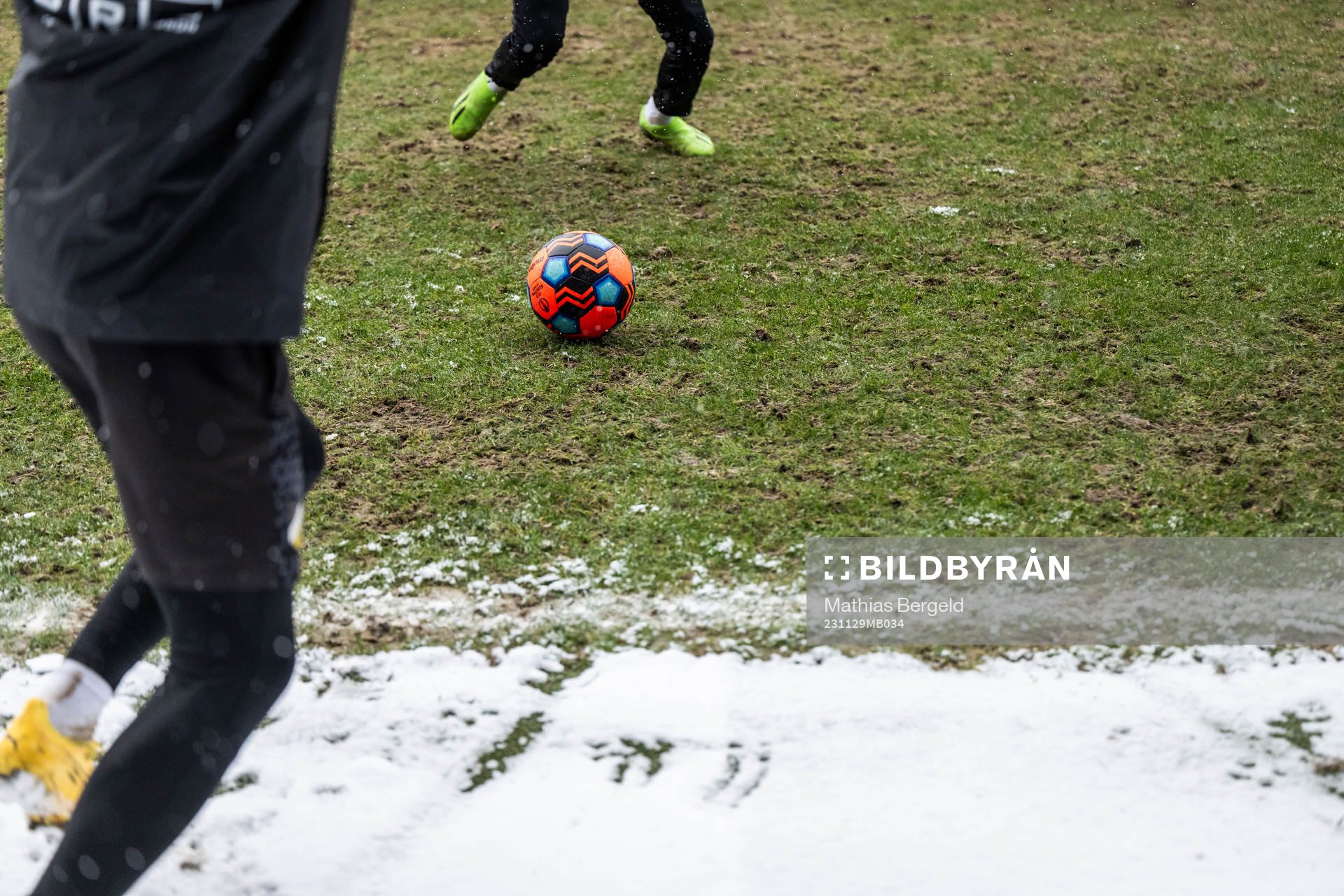 Feet of players is seen going for a ball