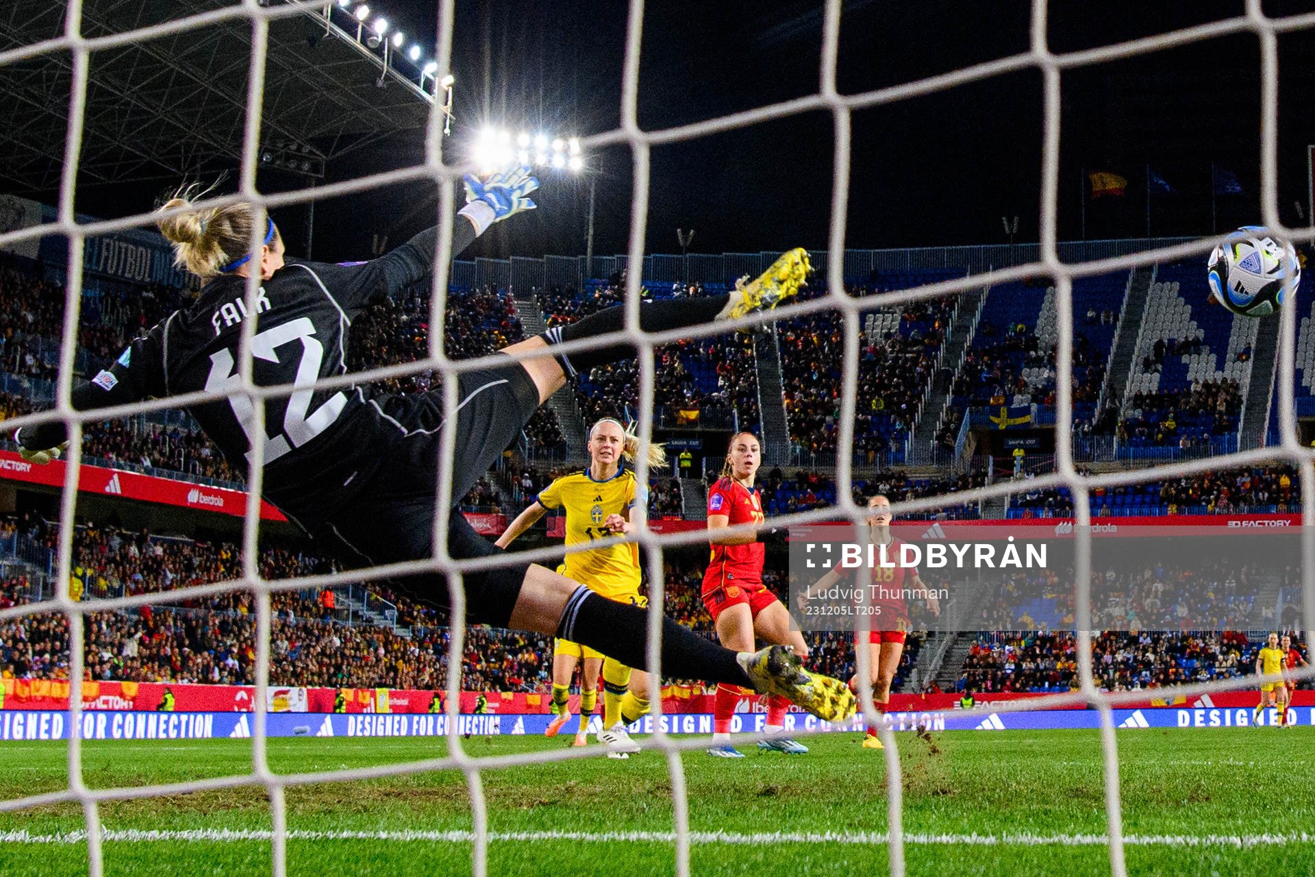 Athenea del Castillo of Spain scores 2-3 behind goalkeeper