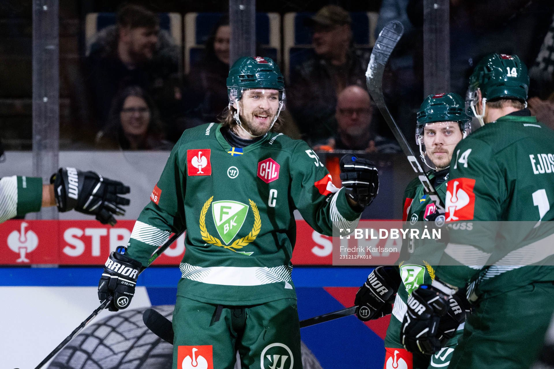 Linus Johansson of Färjestad celebrates with team mates