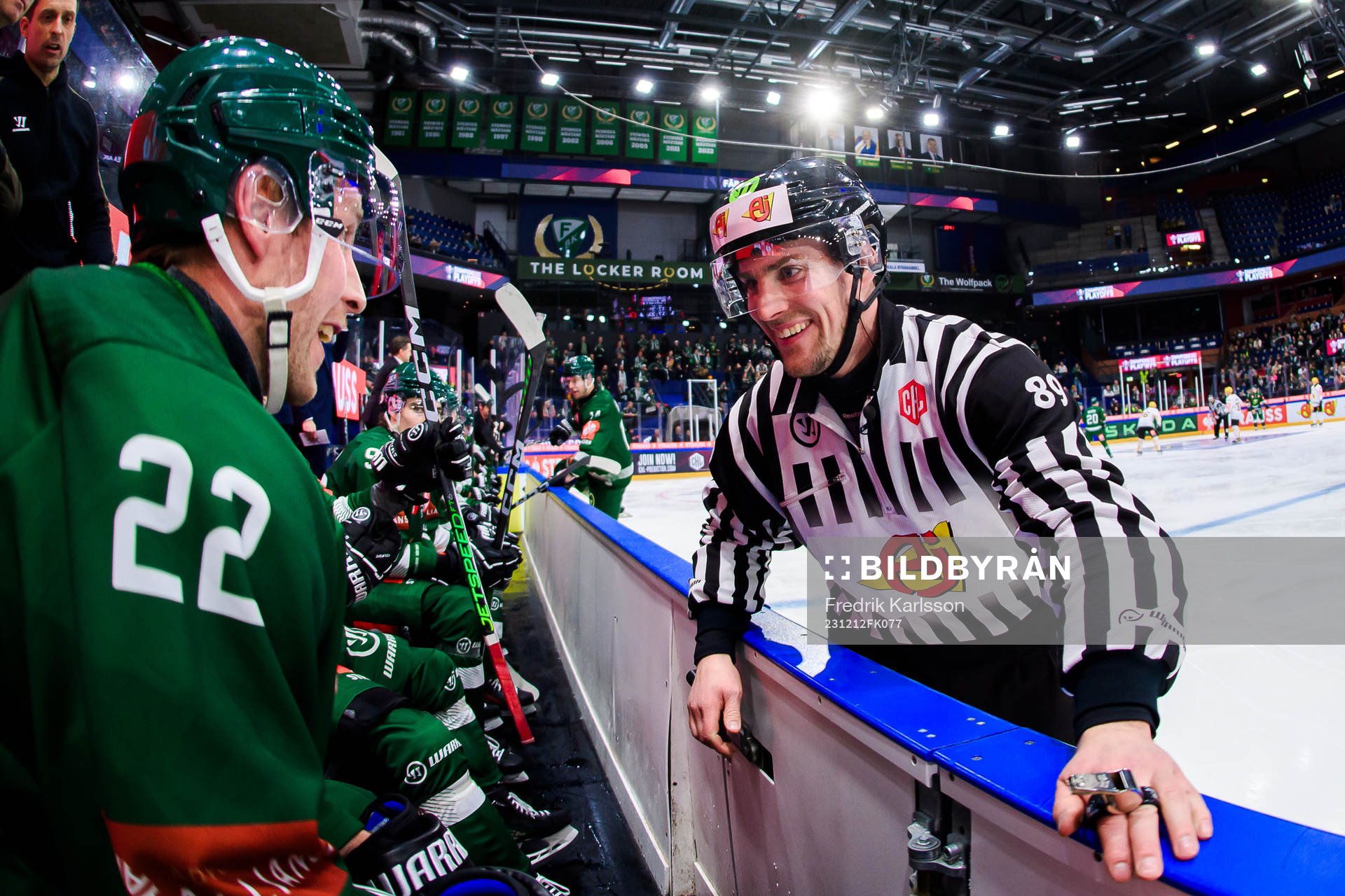 Per Åslund of Färjestad and linesman Gustav Jonsson